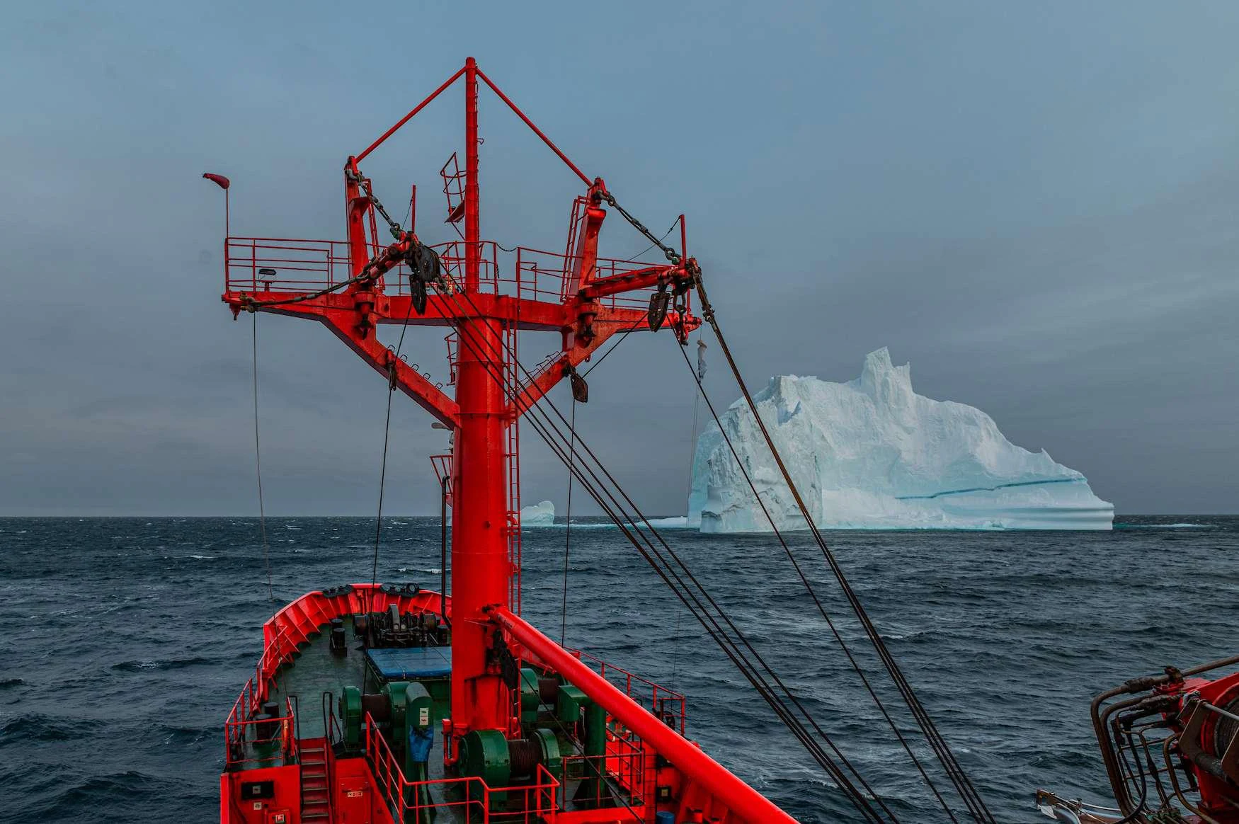 a red crane on a boat aboard ARGUS Yacht for Charter