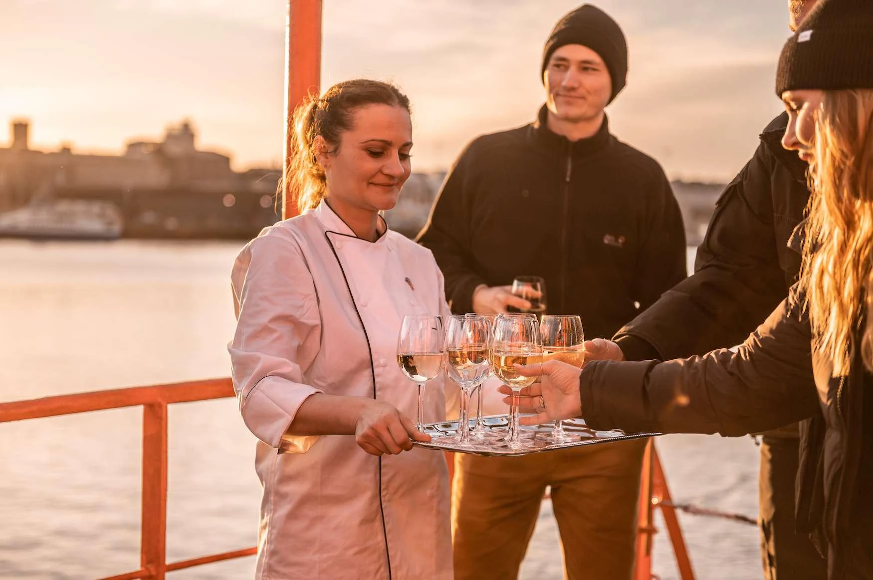 a group of people drinking wine aboard ARGUS Yacht for Charter