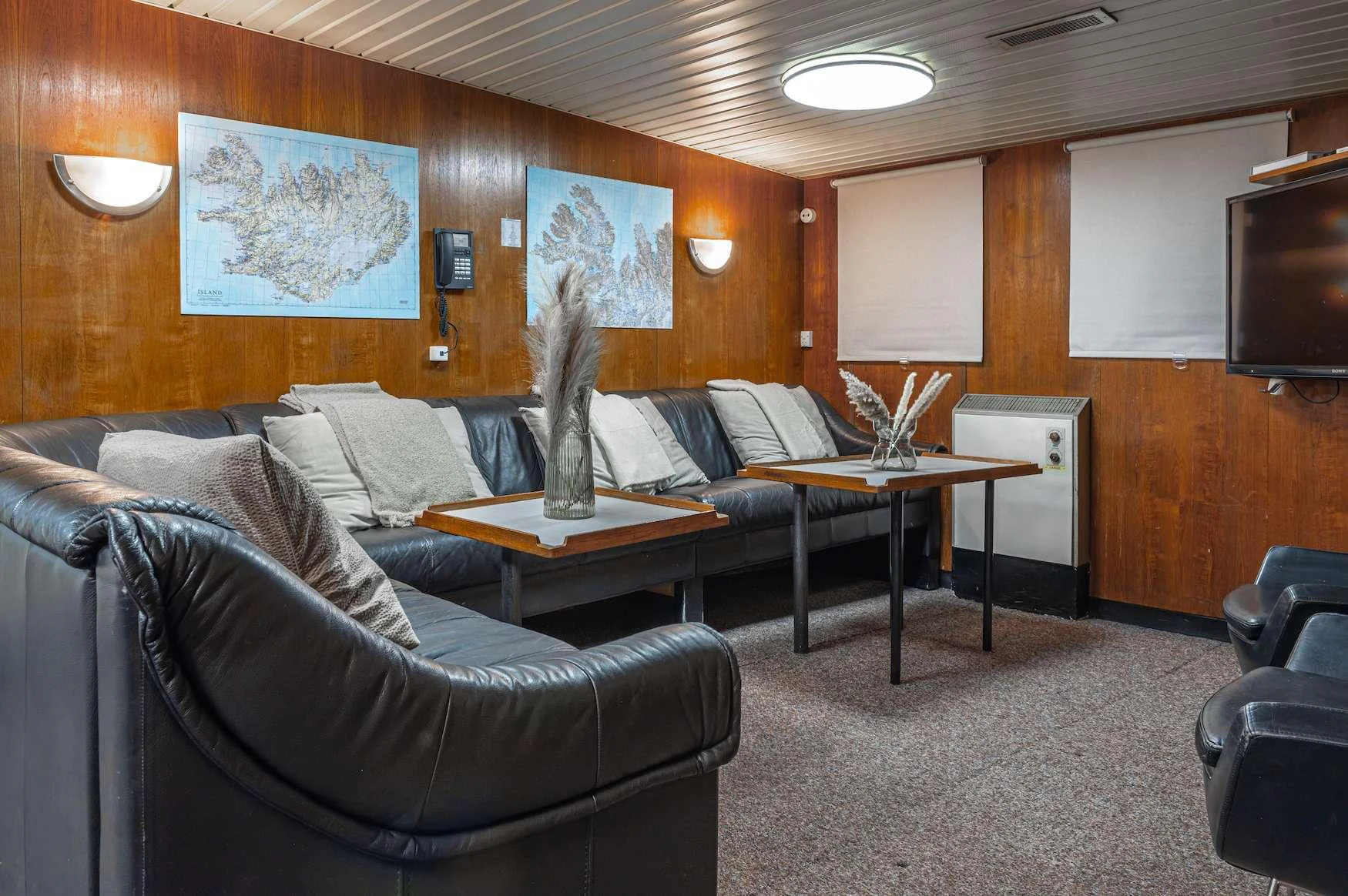a living room with a couch and a coffee table aboard ARGUS Yacht for Charter