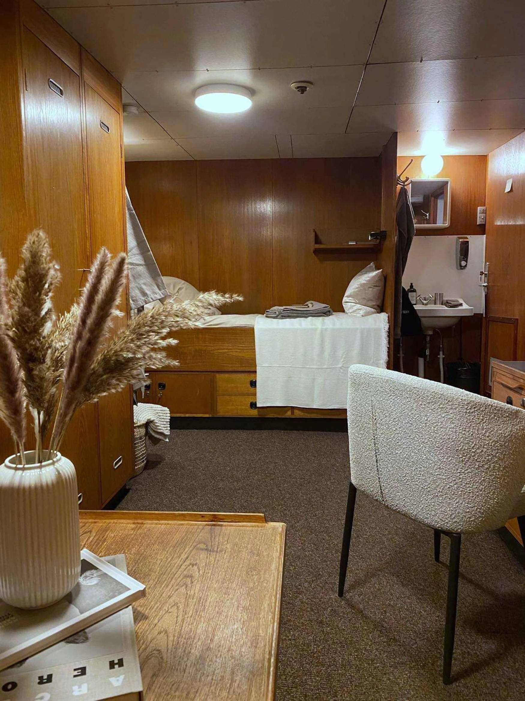 a room with a table and chairs aboard ARGUS Yacht for Charter