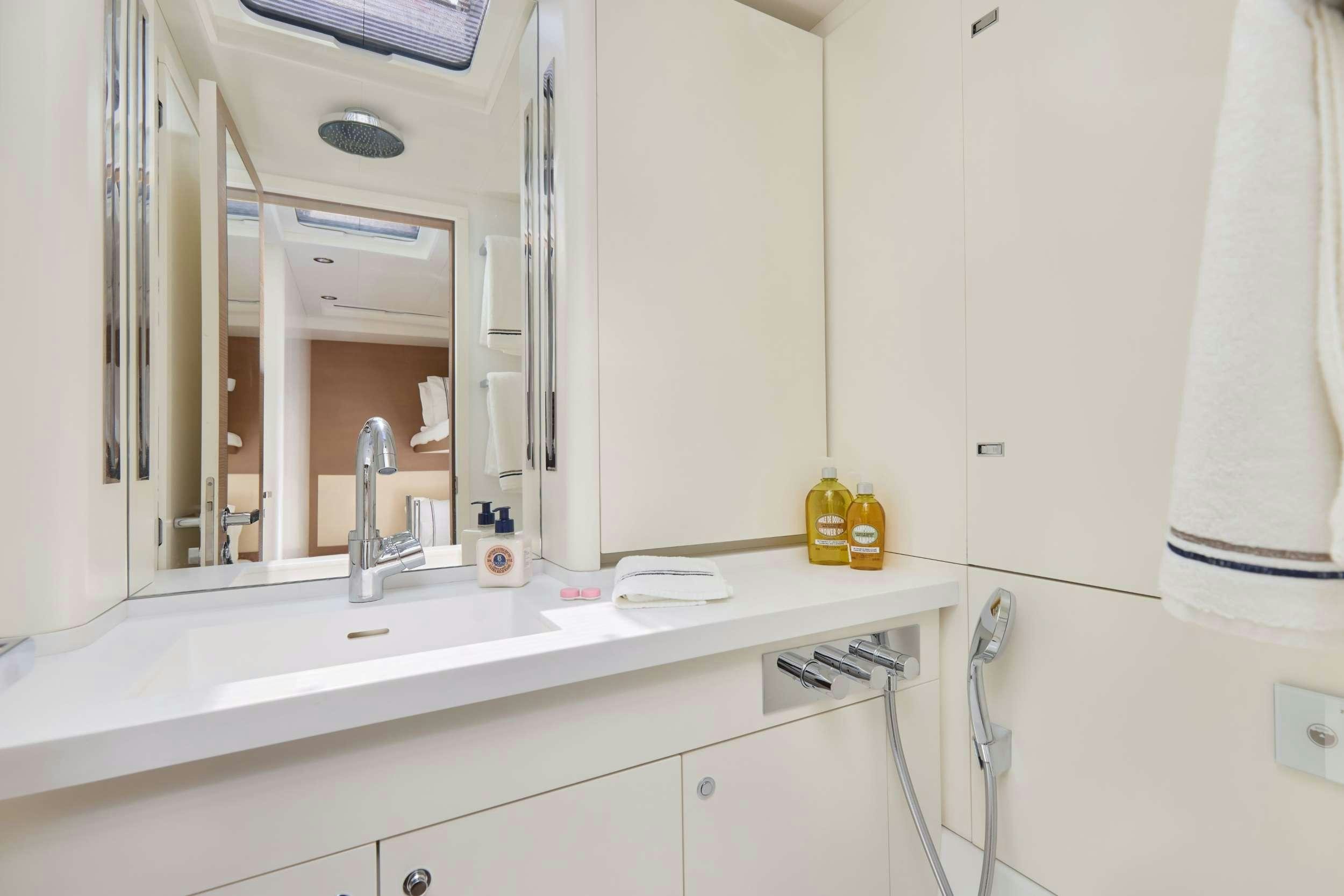 a bathroom with a large mirror aboard GRATEFUL Yacht for Charter