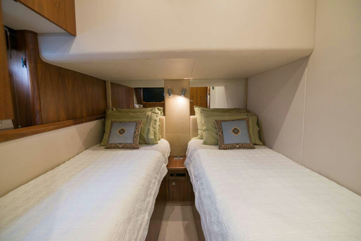 a couple of beds in a room aboard ELENTARI Yacht for Charter
