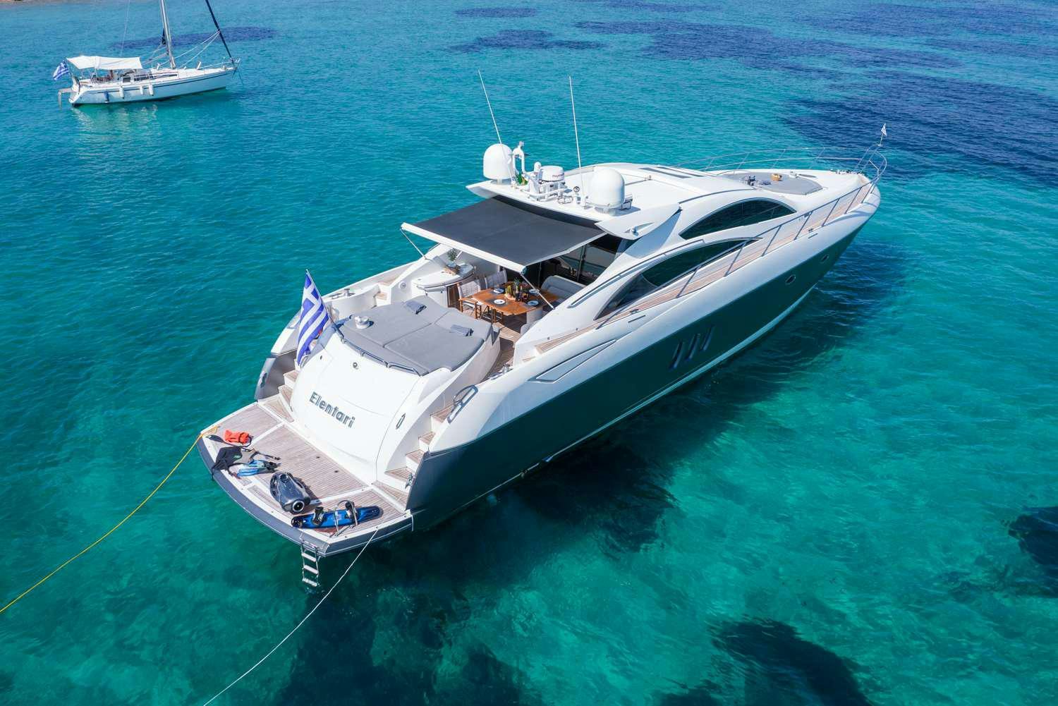 a white boat on the water aboard ELENTARI Yacht for Charter