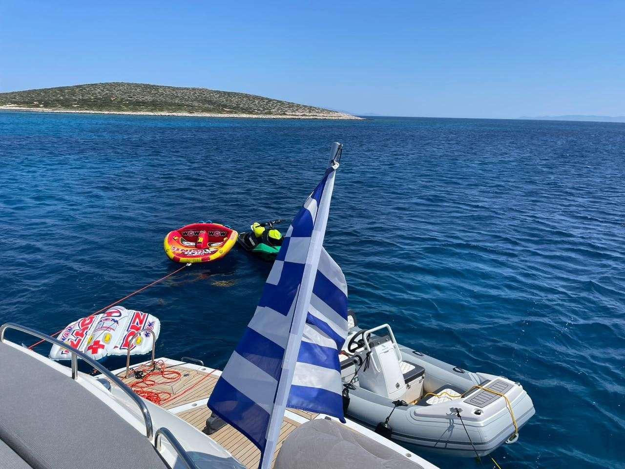 a group of people on a boat aboard ELENTARI Yacht for Charter