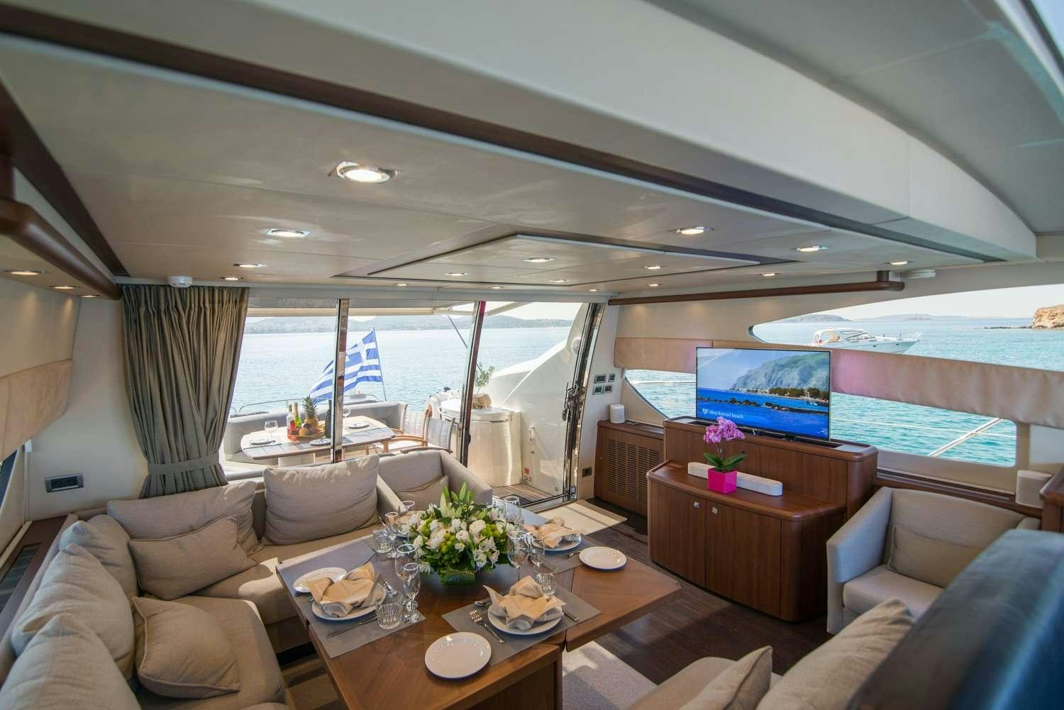 a living room with a large window aboard ELENTARI Yacht for Charter