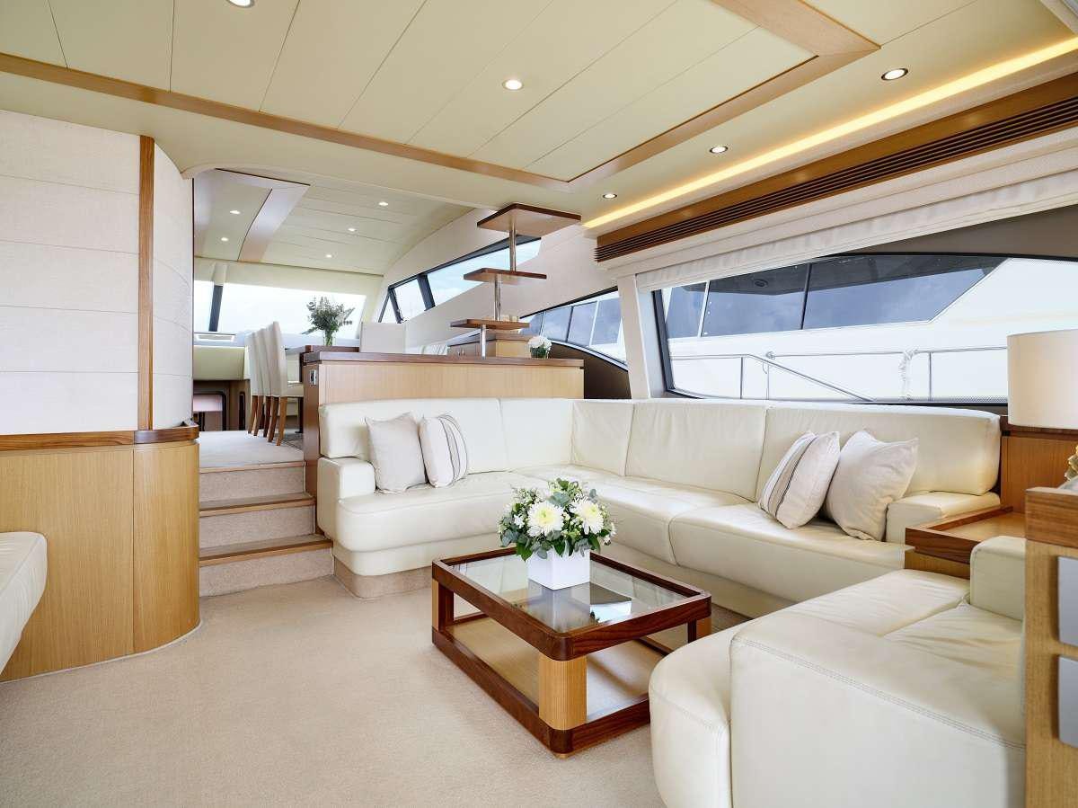 a living room with a large window aboard FLOW Yacht for Charter
