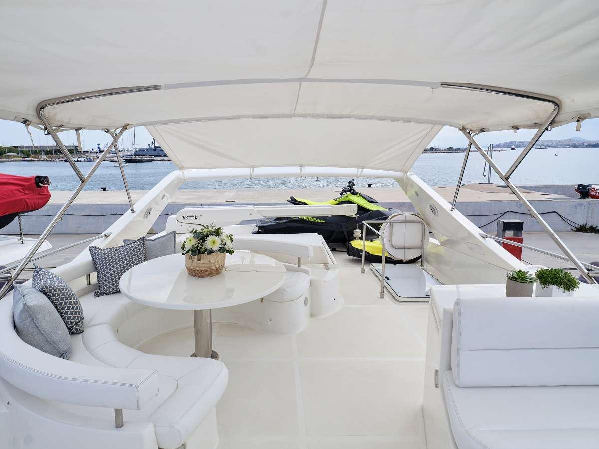 a table and chairs on a patio aboard FLOW Yacht for Charter