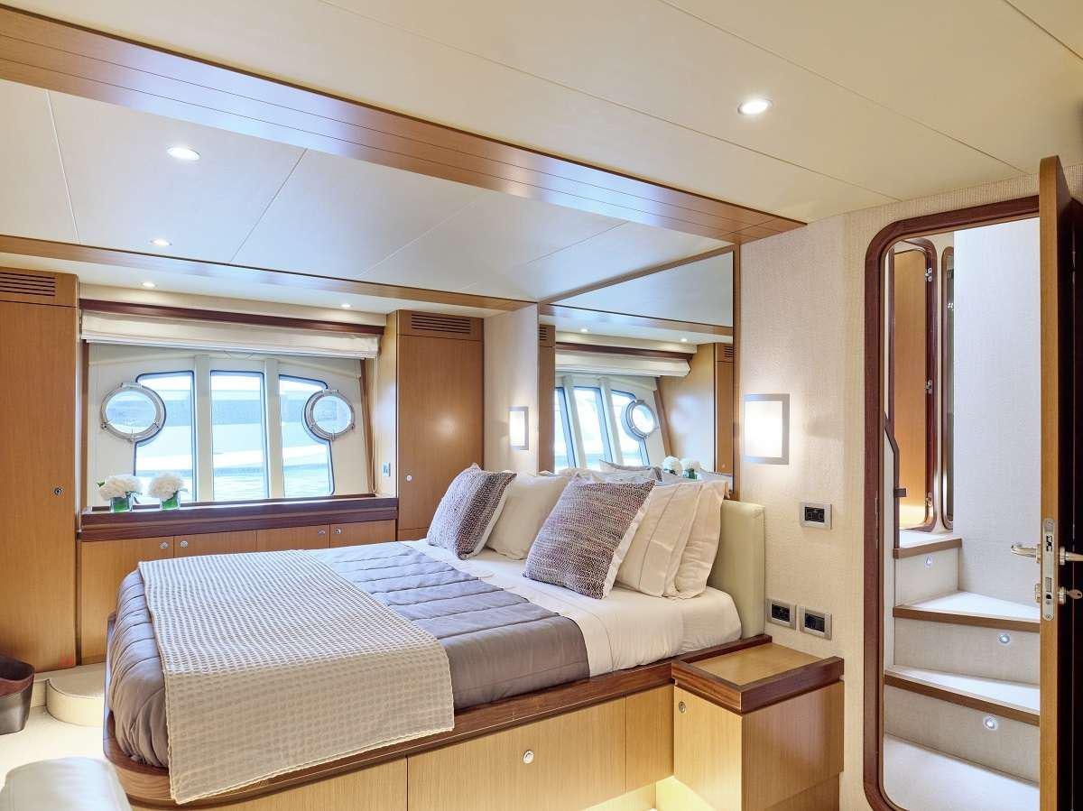 a bed in a room aboard FLOW Yacht for Charter