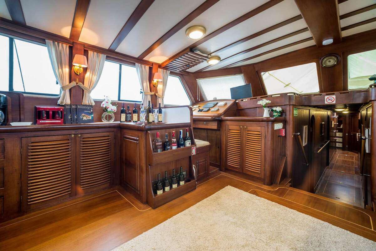 a bar with a bar and shelves aboard P Yacht for Charter