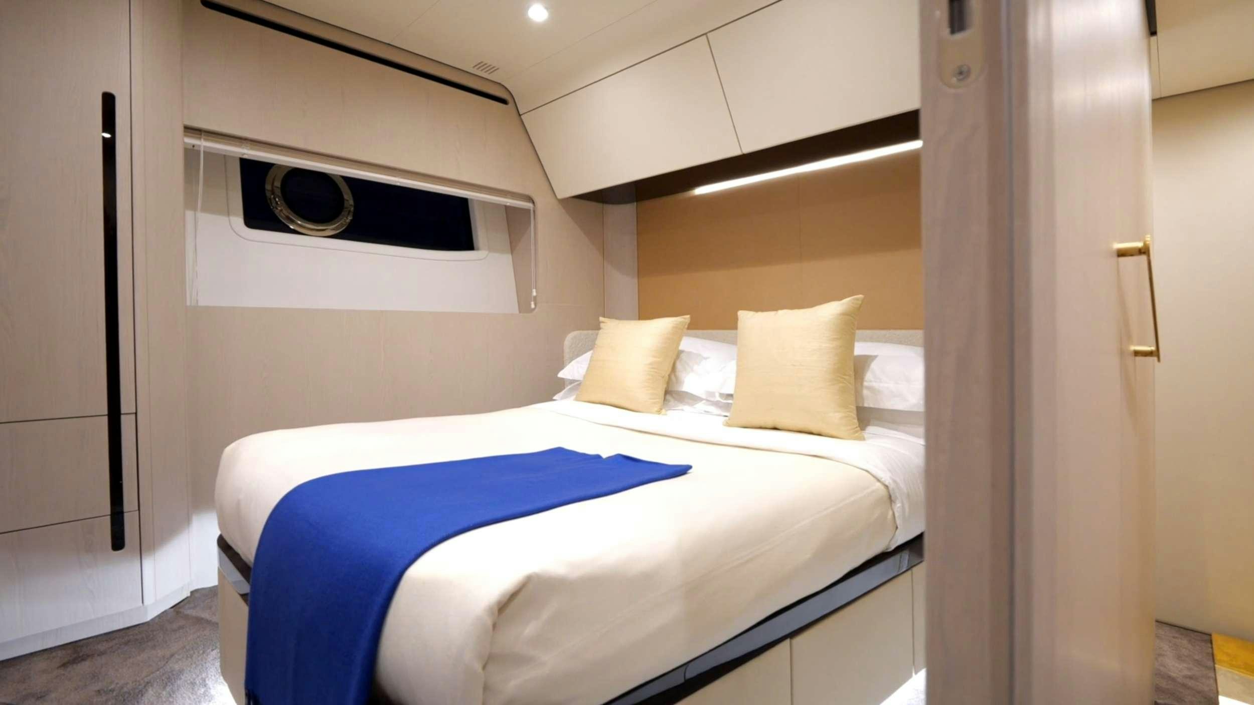 a couple of beds in a room aboard PARADISE PEARL Yacht for Charter