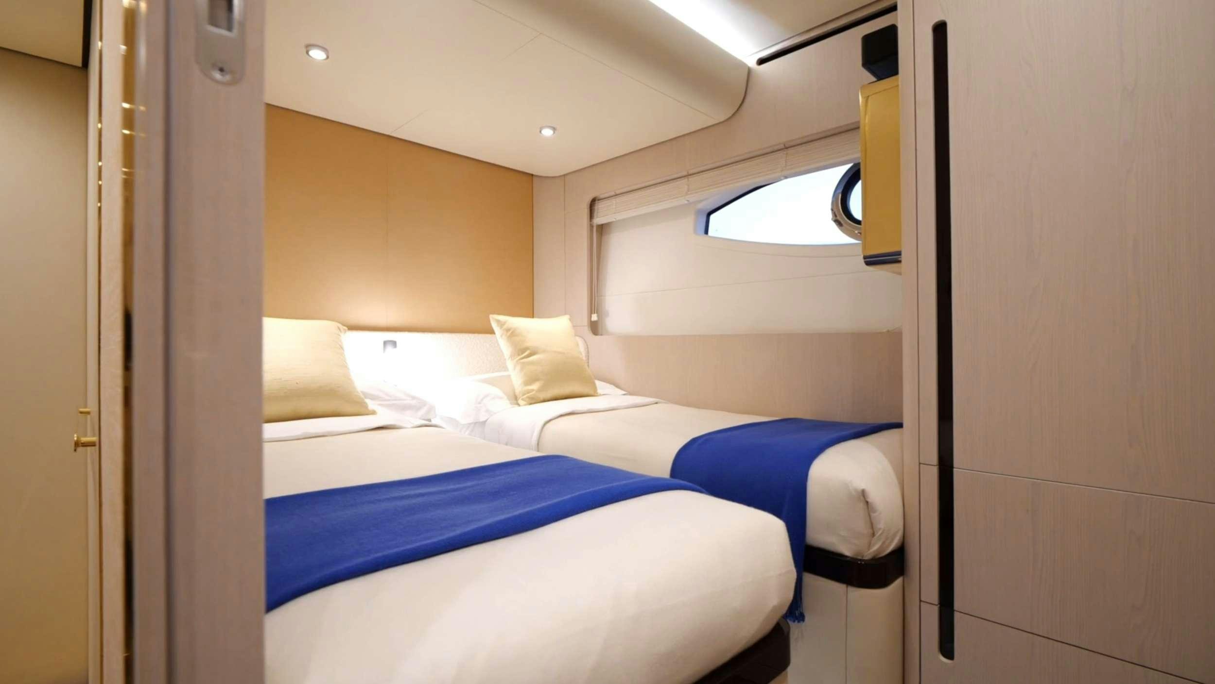 a room with beds aboard PARADISE PEARL Yacht for Charter