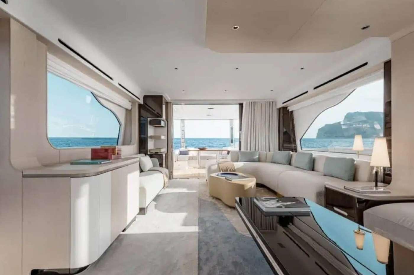 a living room with a large window aboard PARADISE PEARL Yacht for Charter