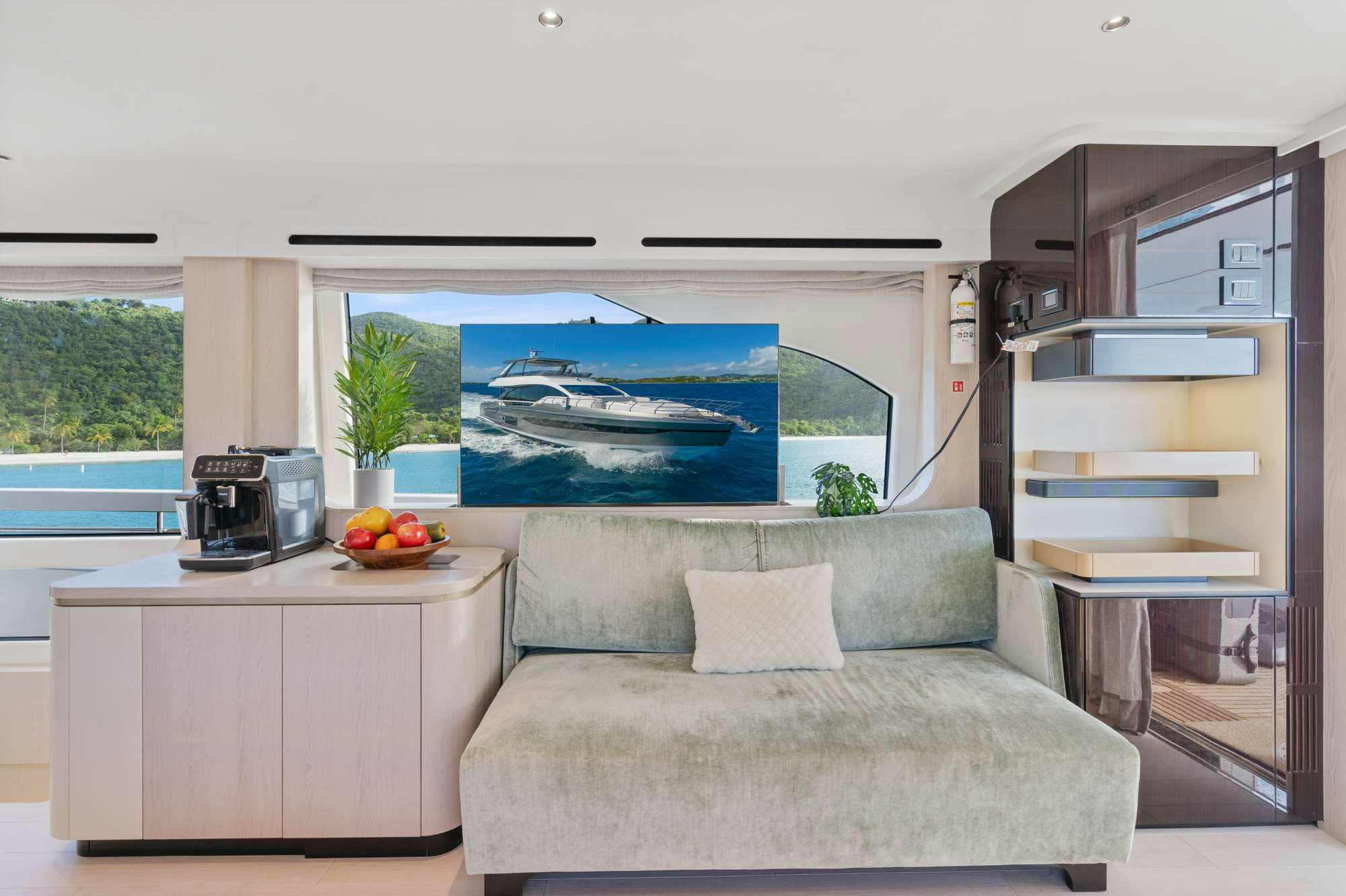 a living room with a couch and a tv aboard PARADISE PEARL Yacht for Charter