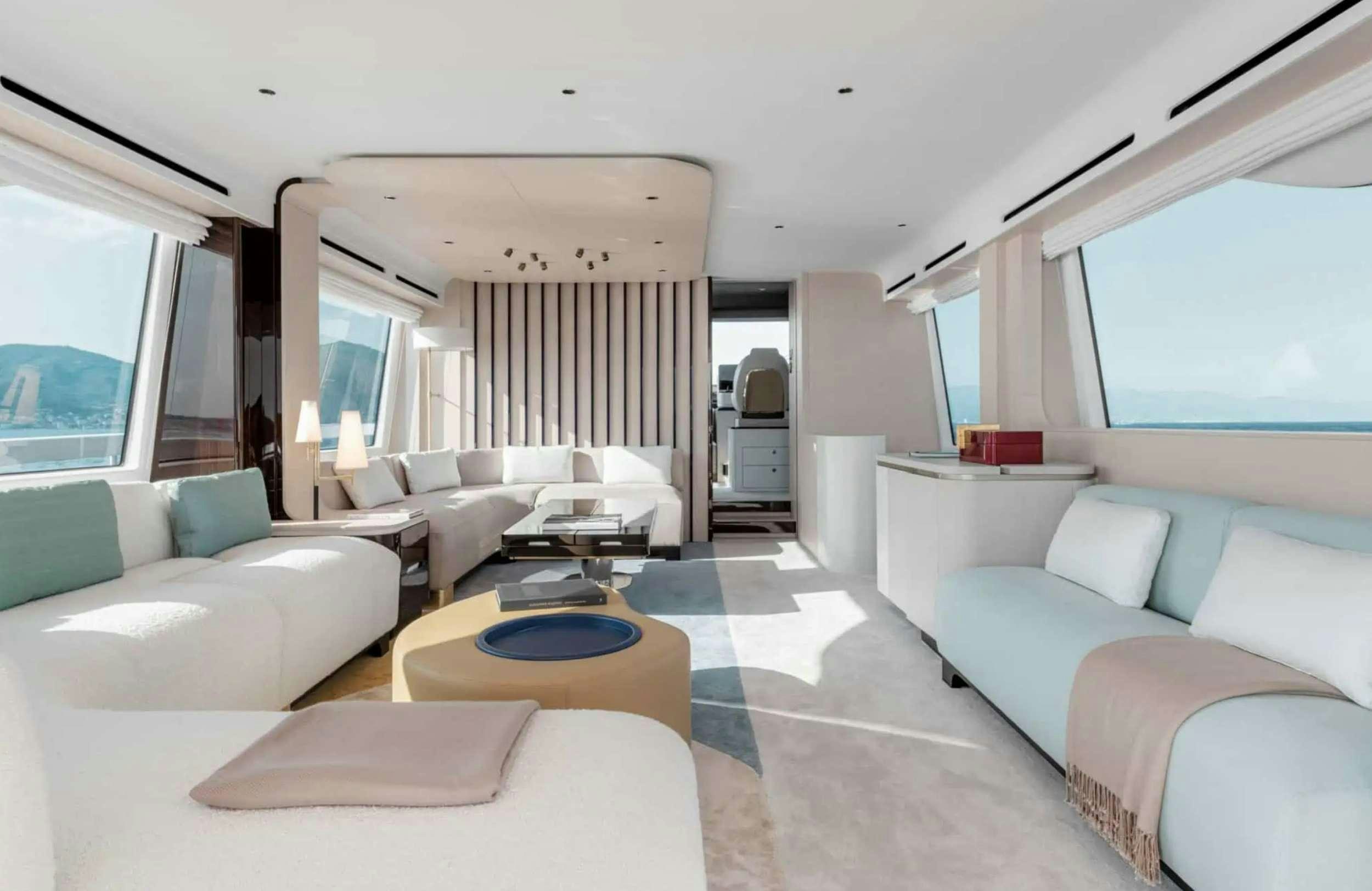 a living room with a bed and a couch aboard PARADISE PEARL Yacht for Charter