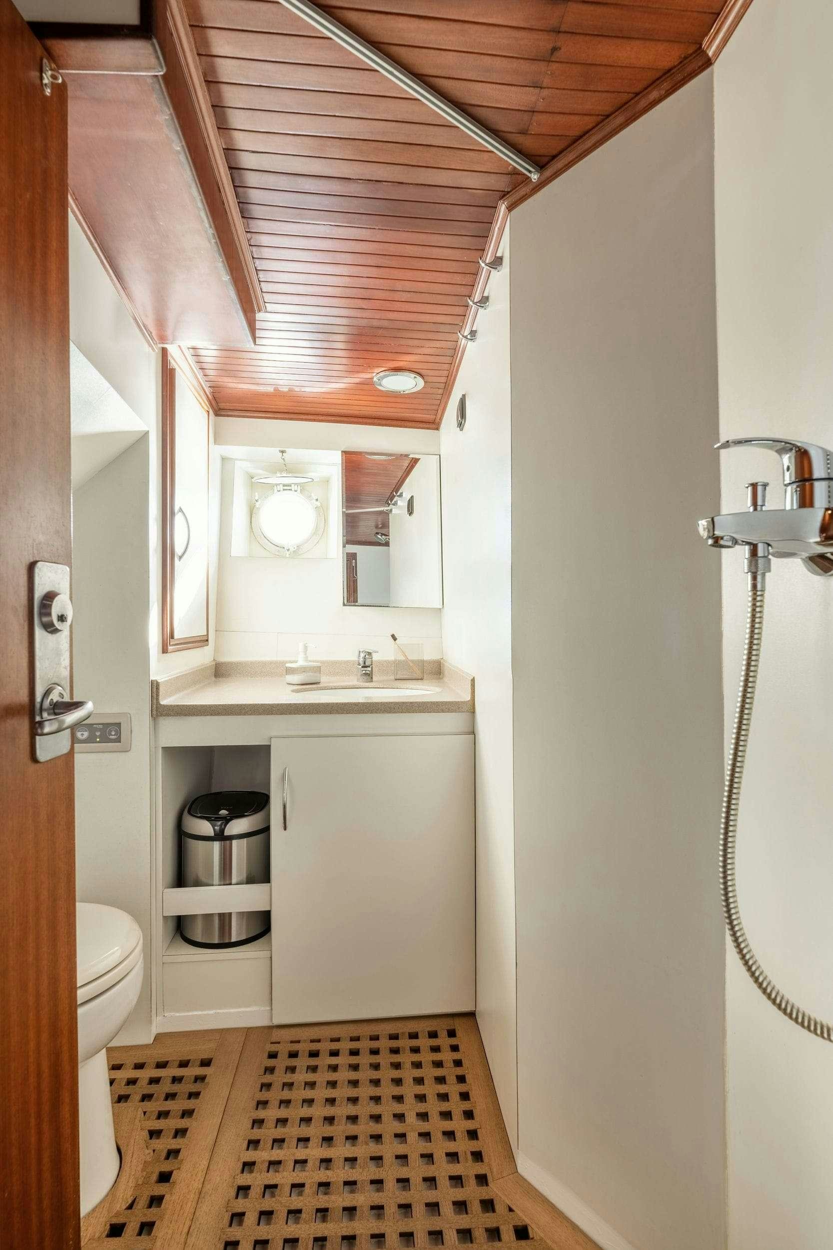 a bathroom with a sink and a toilet aboard LITHI Yacht for Charter