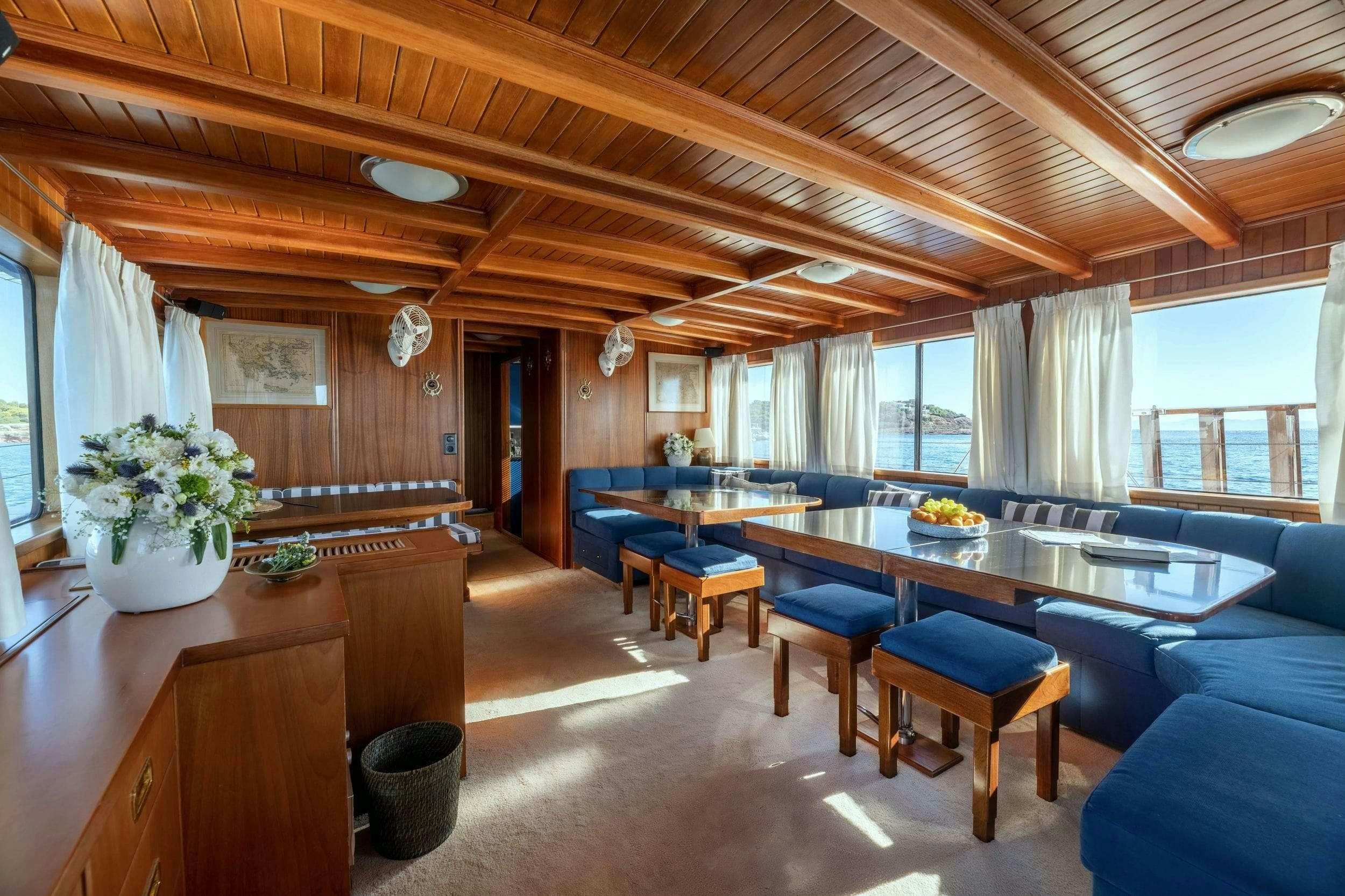 a large kitchen and dining room aboard LITHI Yacht for Charter