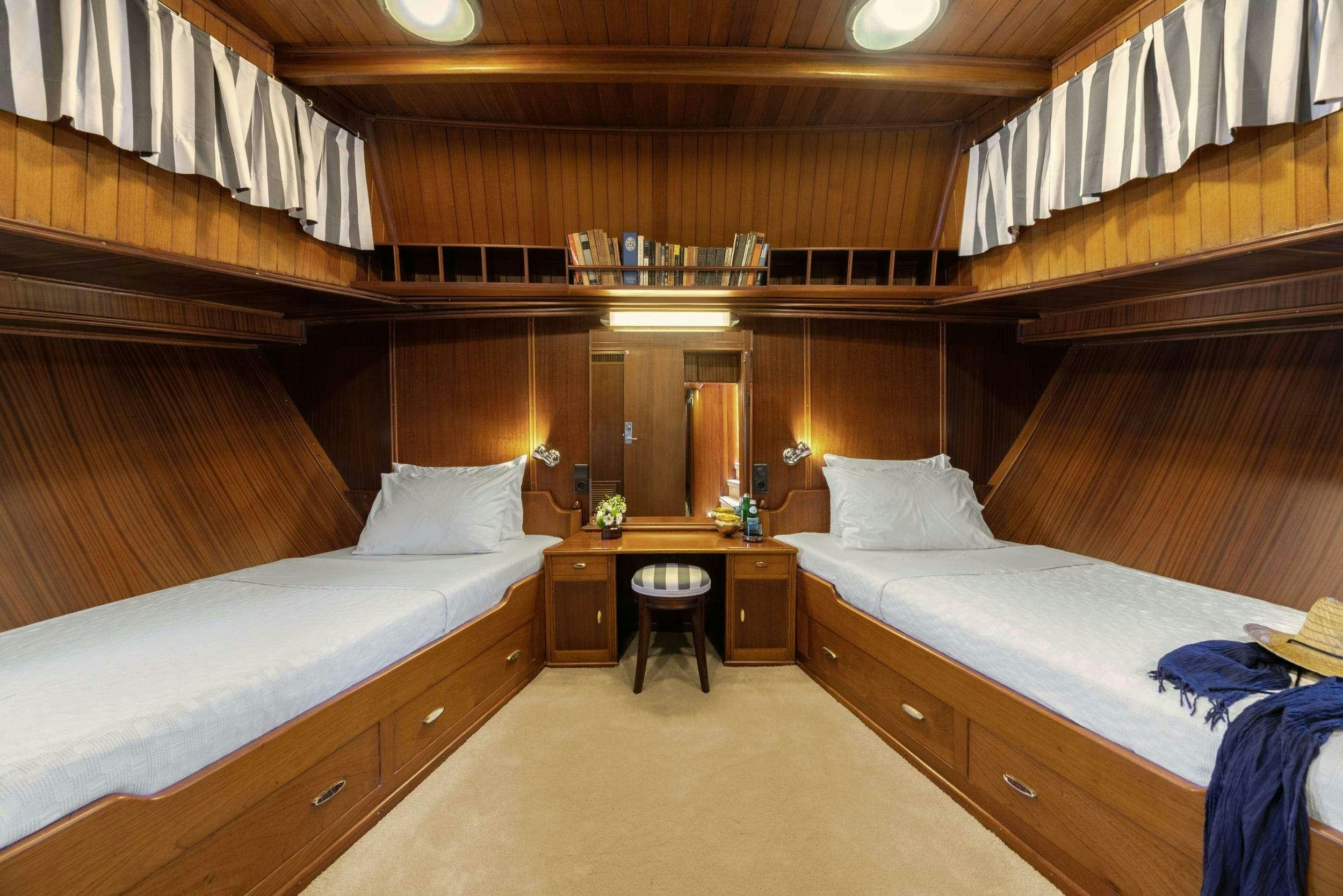 a room with two beds aboard LITHI Yacht for Charter