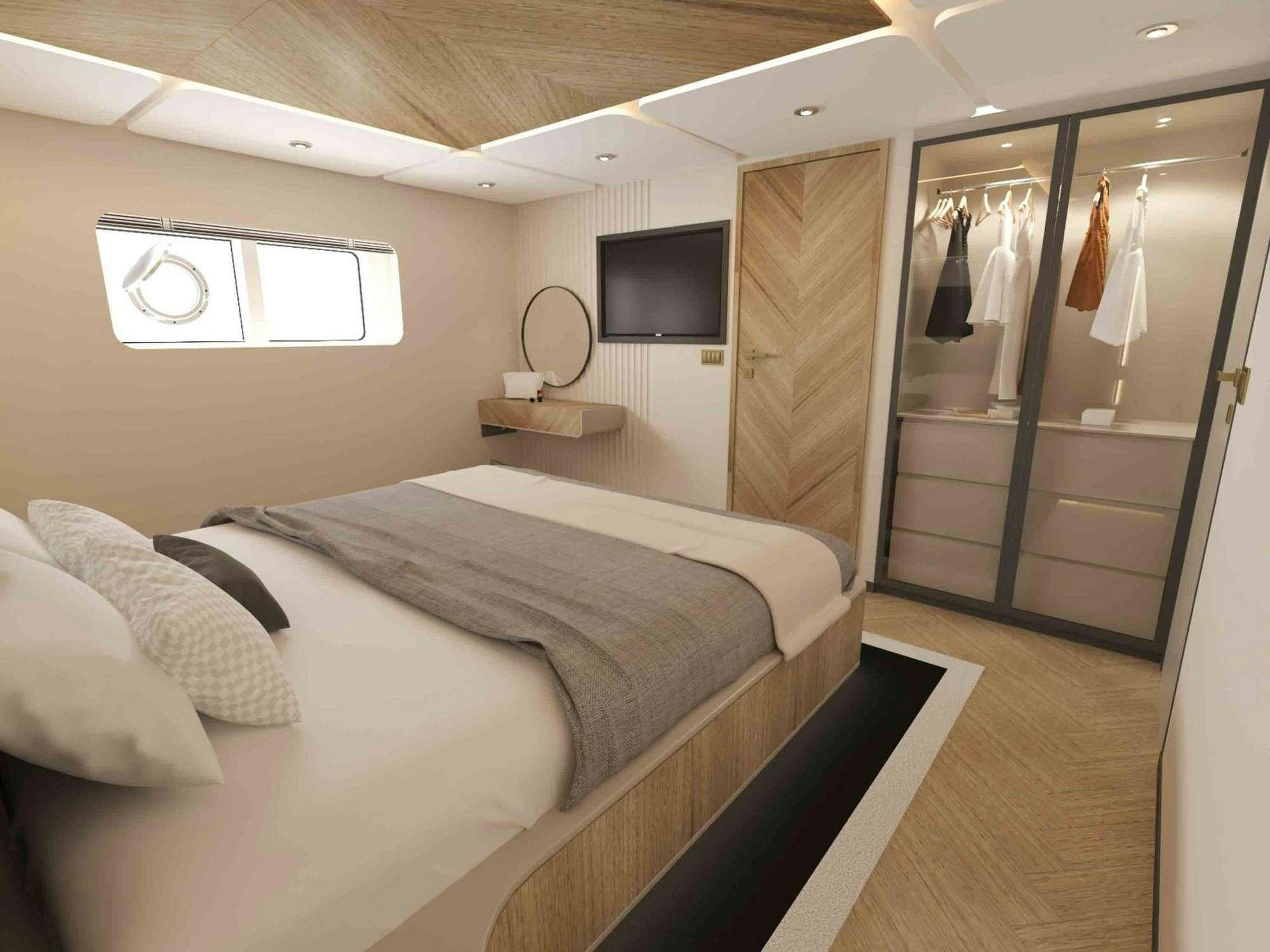 a bedroom with a bed and a television aboard KING OF THE SEA Yacht for Charter