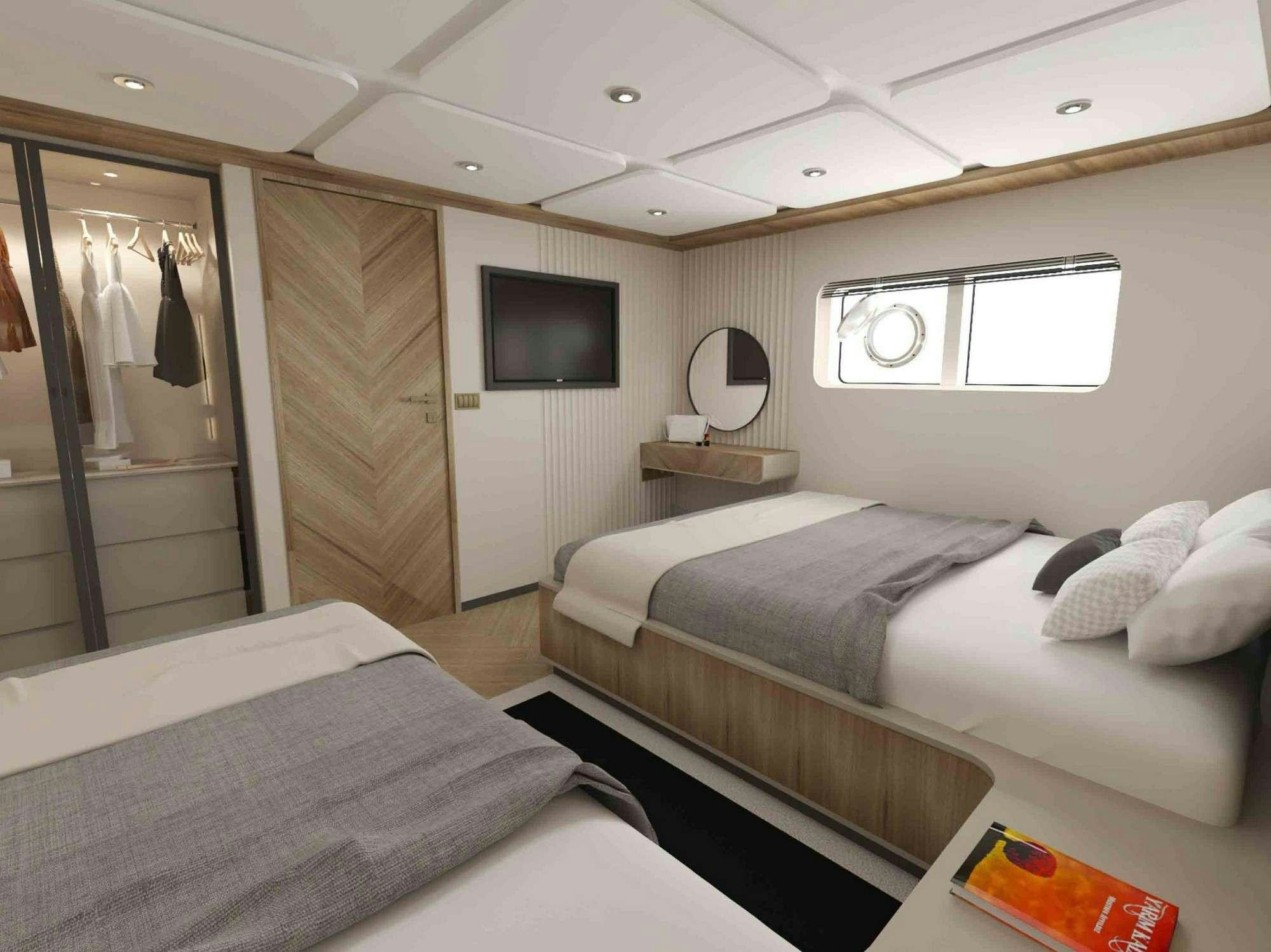 a room with two beds aboard KING OF THE SEA Yacht for Charter