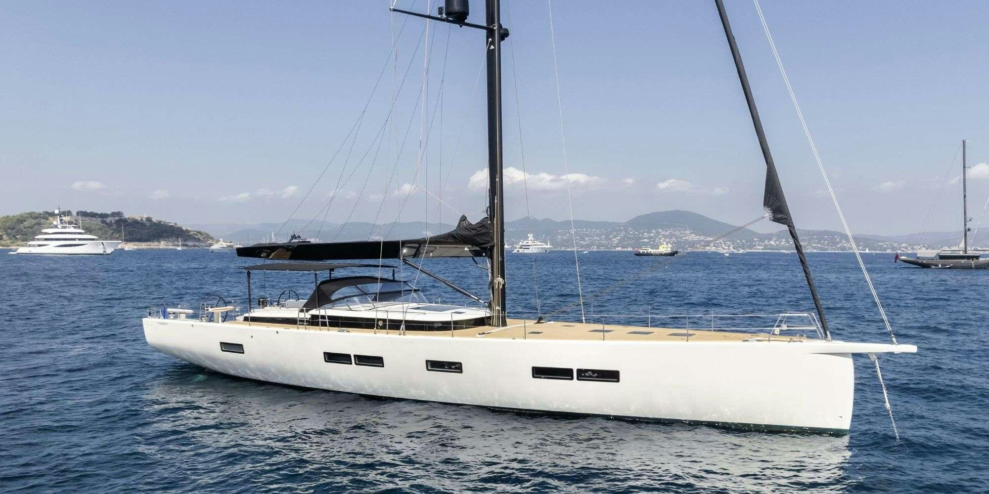 a white boat in the water aboard MYSTIC Yacht for Charter