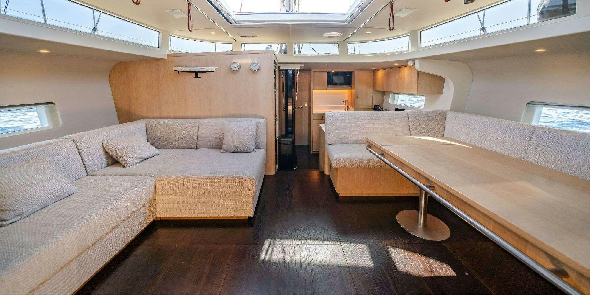a room with a couch and a table aboard MYSTIC Yacht for Charter