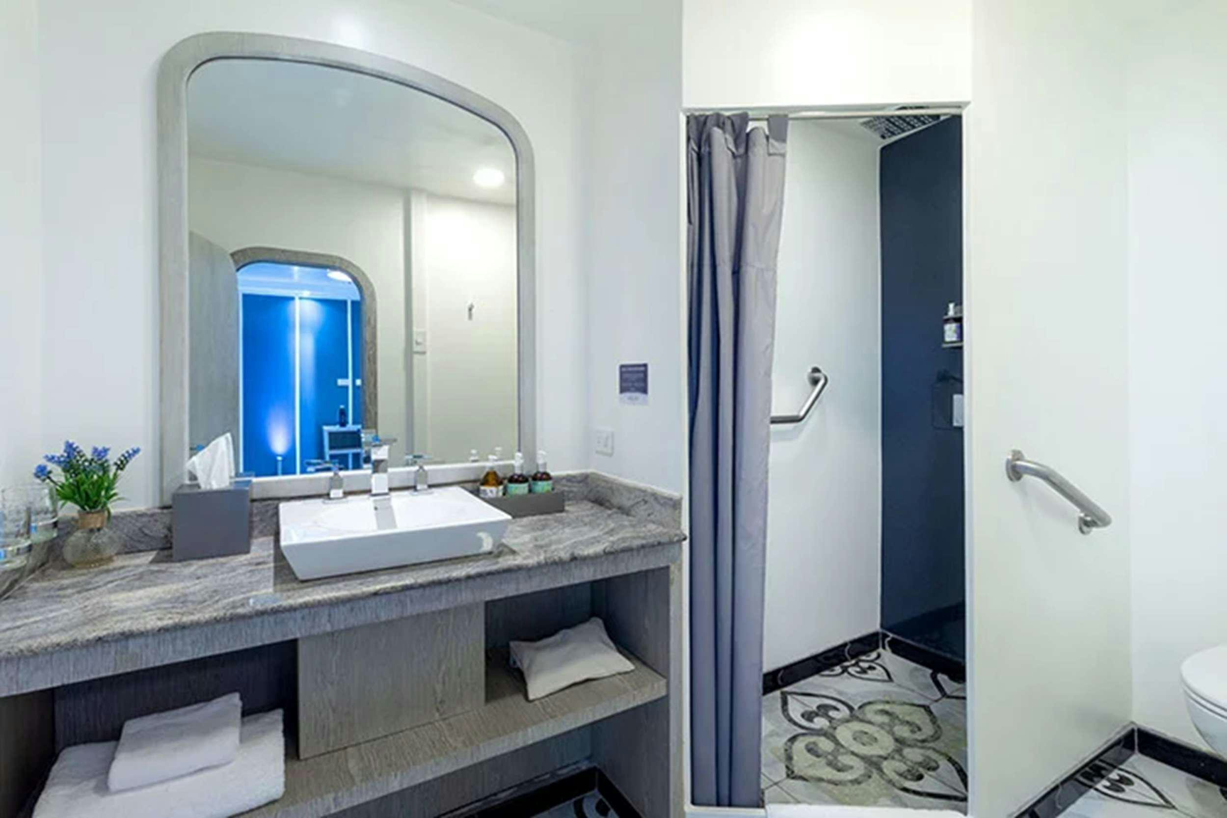 a bathroom with a large mirror aboard GALAPAGOS HORIZON Yacht for Charter