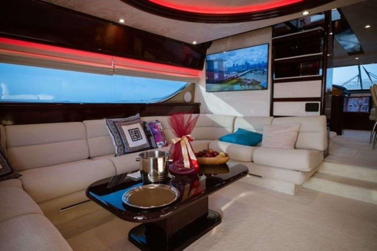 a living room with a large television aboard HASARD Yacht for Charter