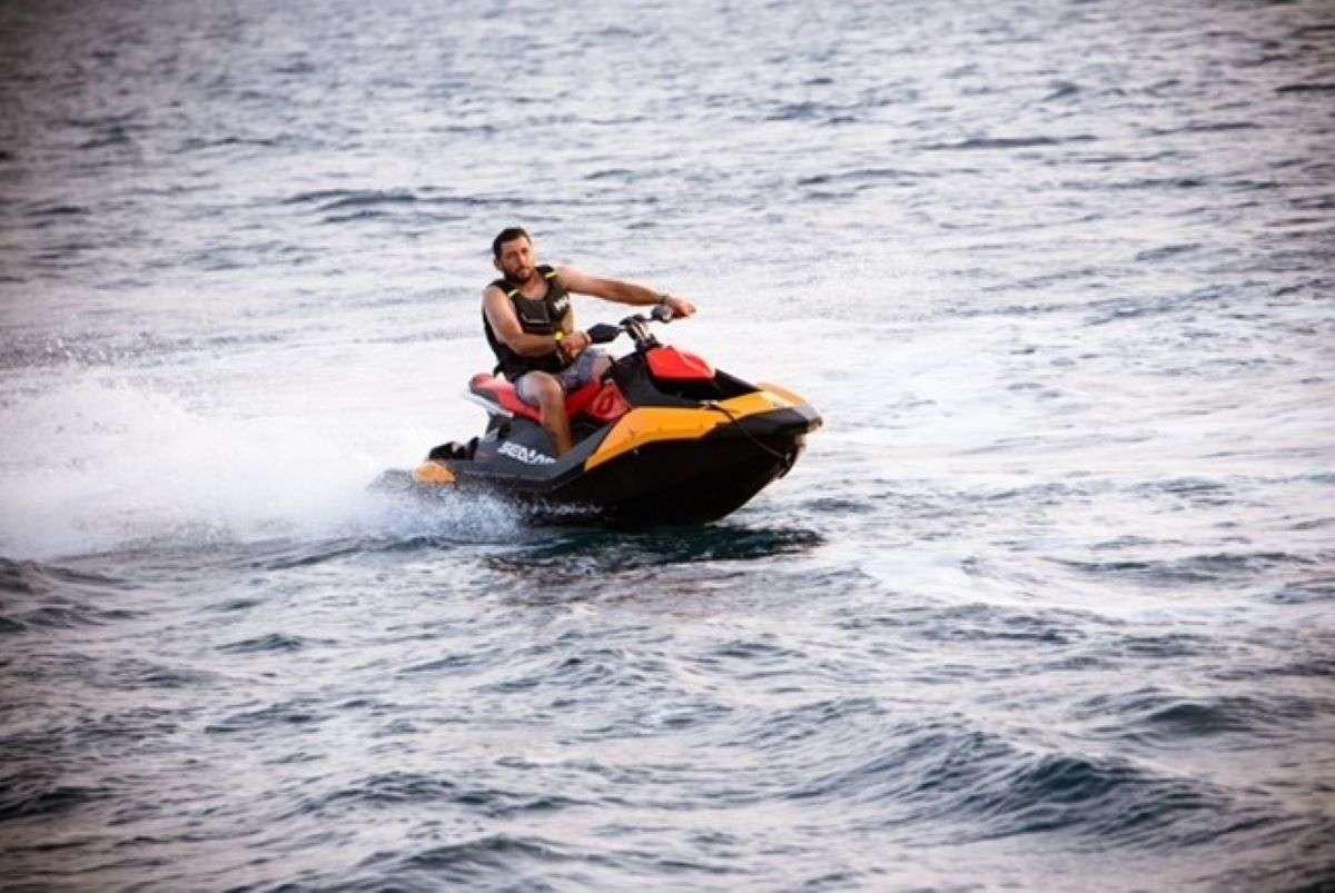 a man on a jet ski aboard HASARD Yacht for Charter