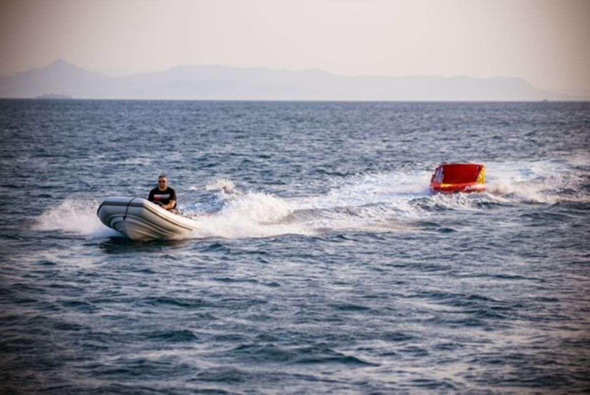 a man on a jet ski aboard HASARD Yacht for Charter