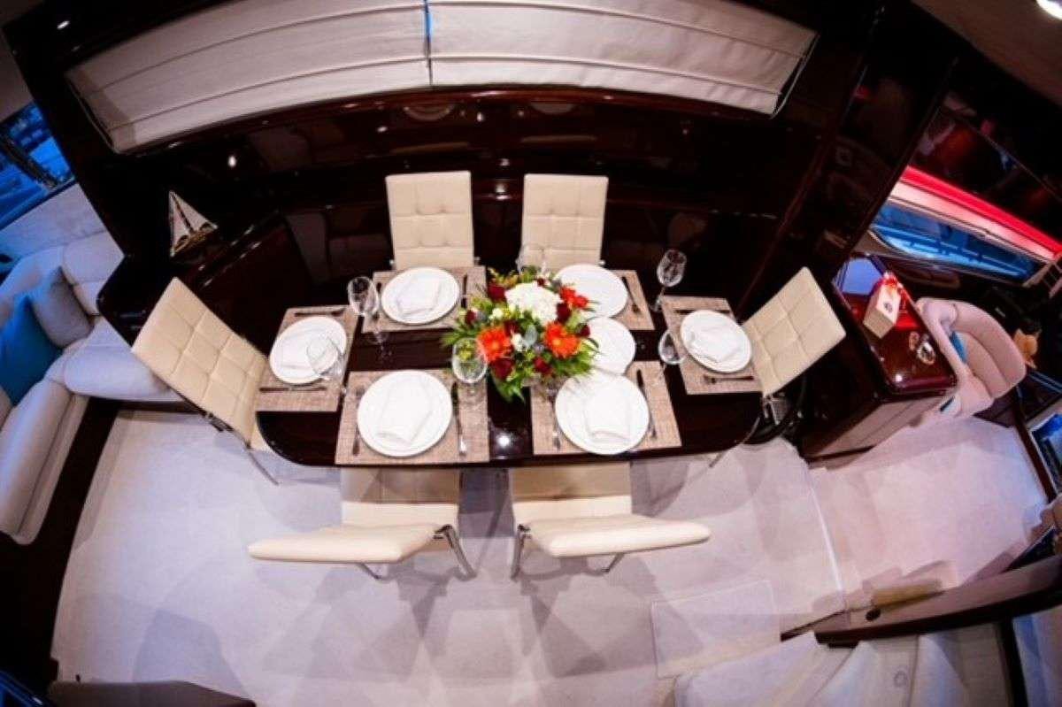 a table with plates and napkins aboard HASARD Yacht for Charter