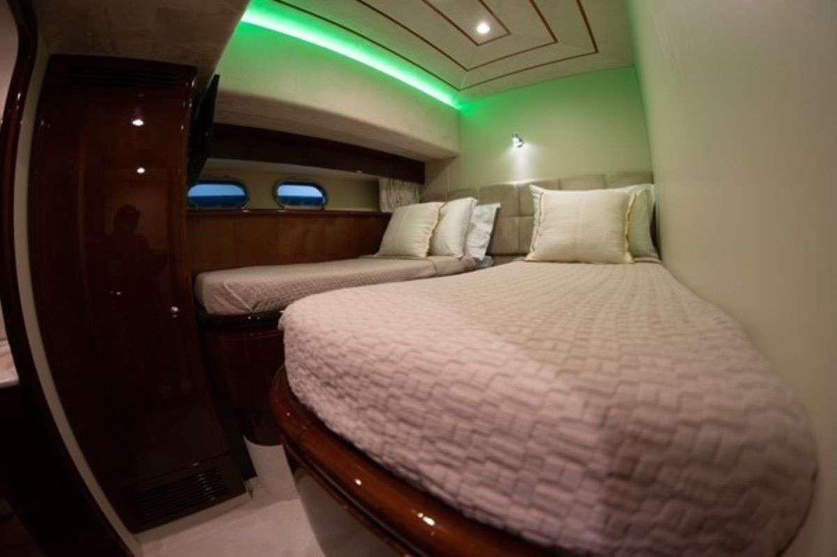 a couple of beds in a room aboard HASARD Yacht for Charter