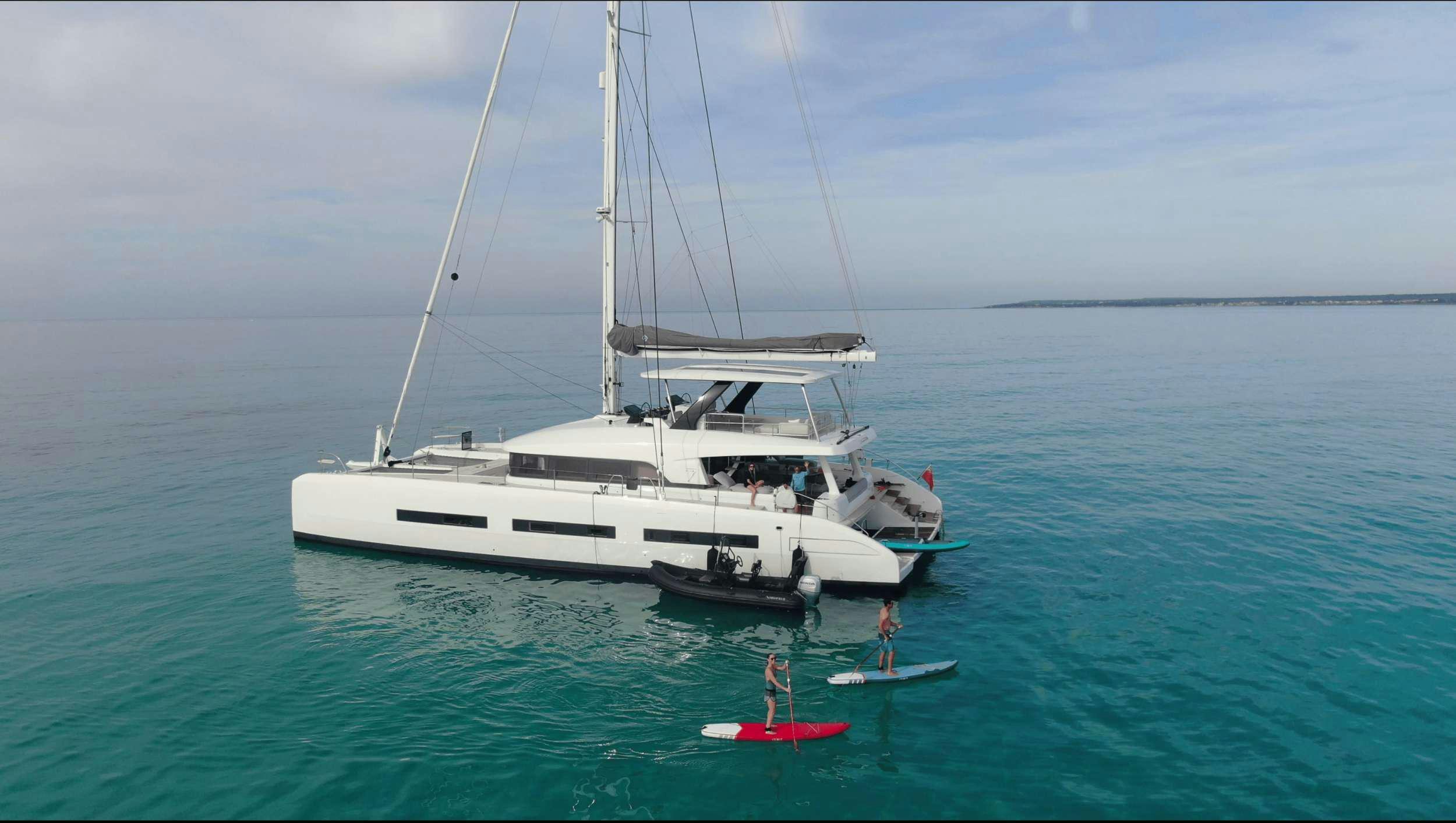 a boat on the water aboard CAT TUA Yacht for Charter