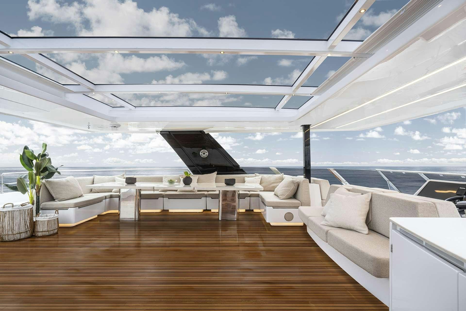 a room with a large glass ceiling aboard MANTA Yacht for Charter