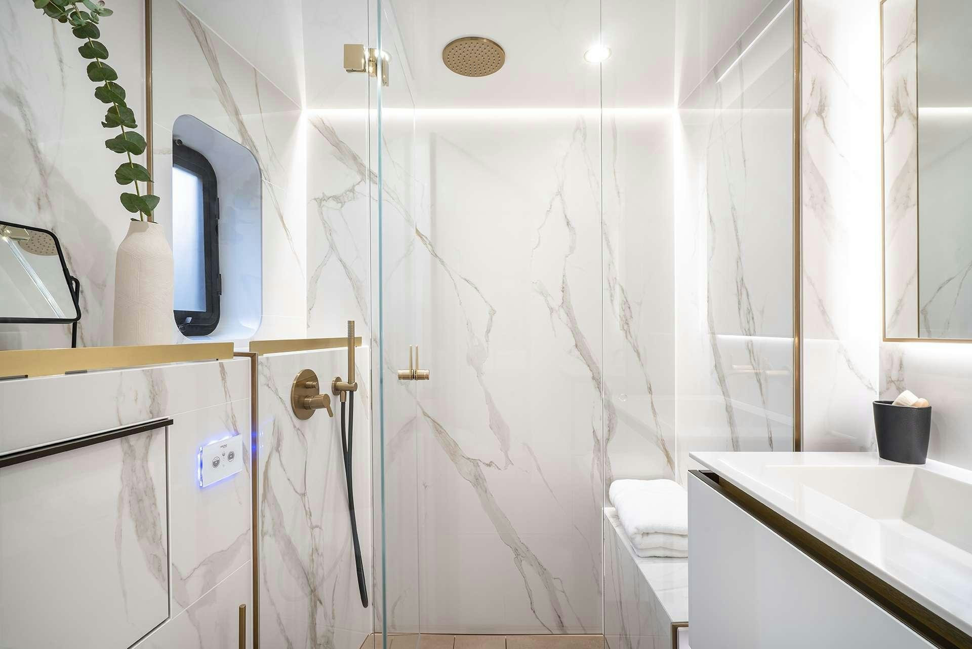 a bathroom with a shower curtain aboard MANTA Yacht for Charter