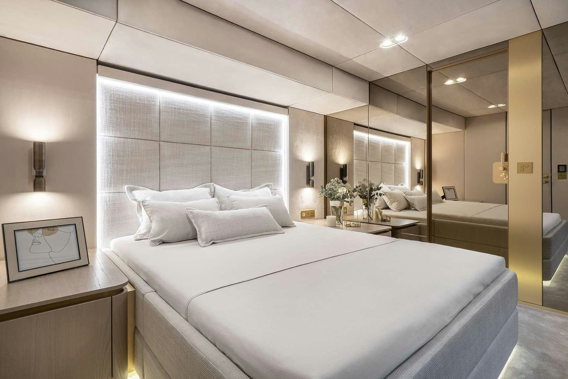 a large bed in a room aboard MANTA Yacht for Charter