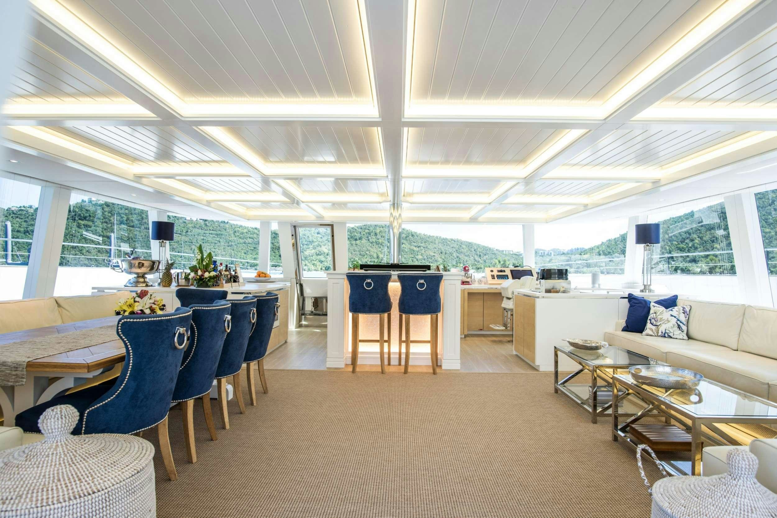 a large living room with a large open floor plan aboard BUNDALONG Yacht for Charter