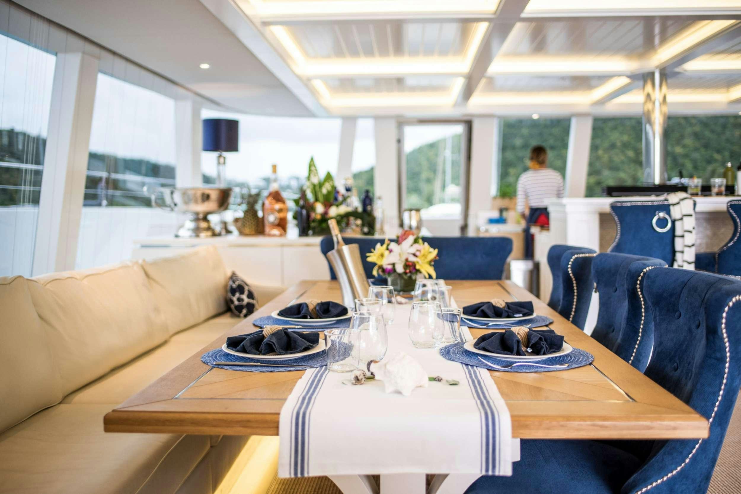 a table set for a meal aboard BUNDALONG Yacht for Charter