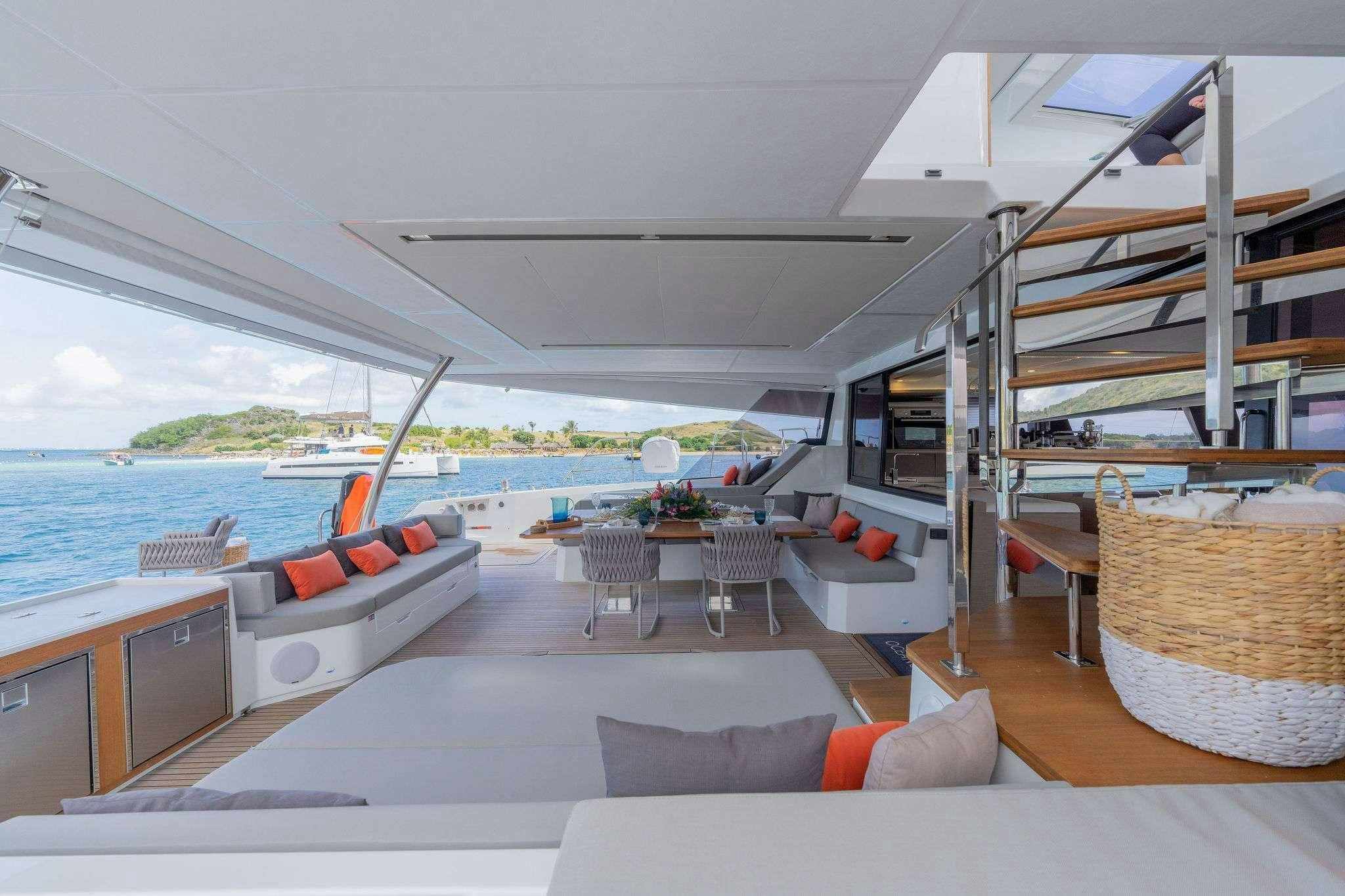 a living room with a large pool aboard LIQUID SKY Yacht for Charter
