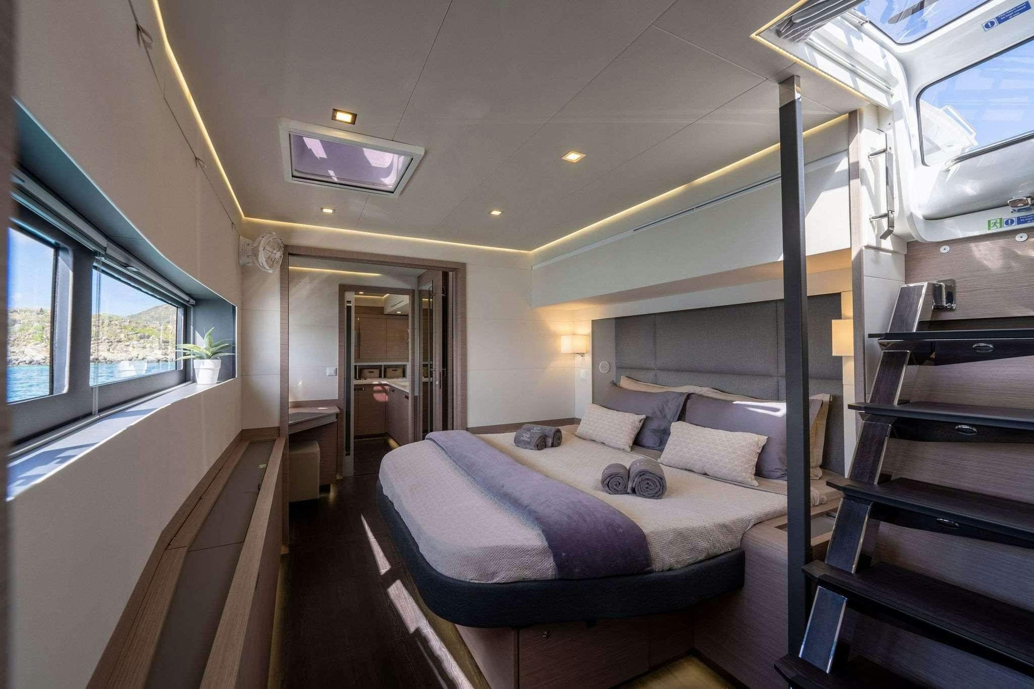 a bed in a room aboard LIQUID SKY Yacht for Charter