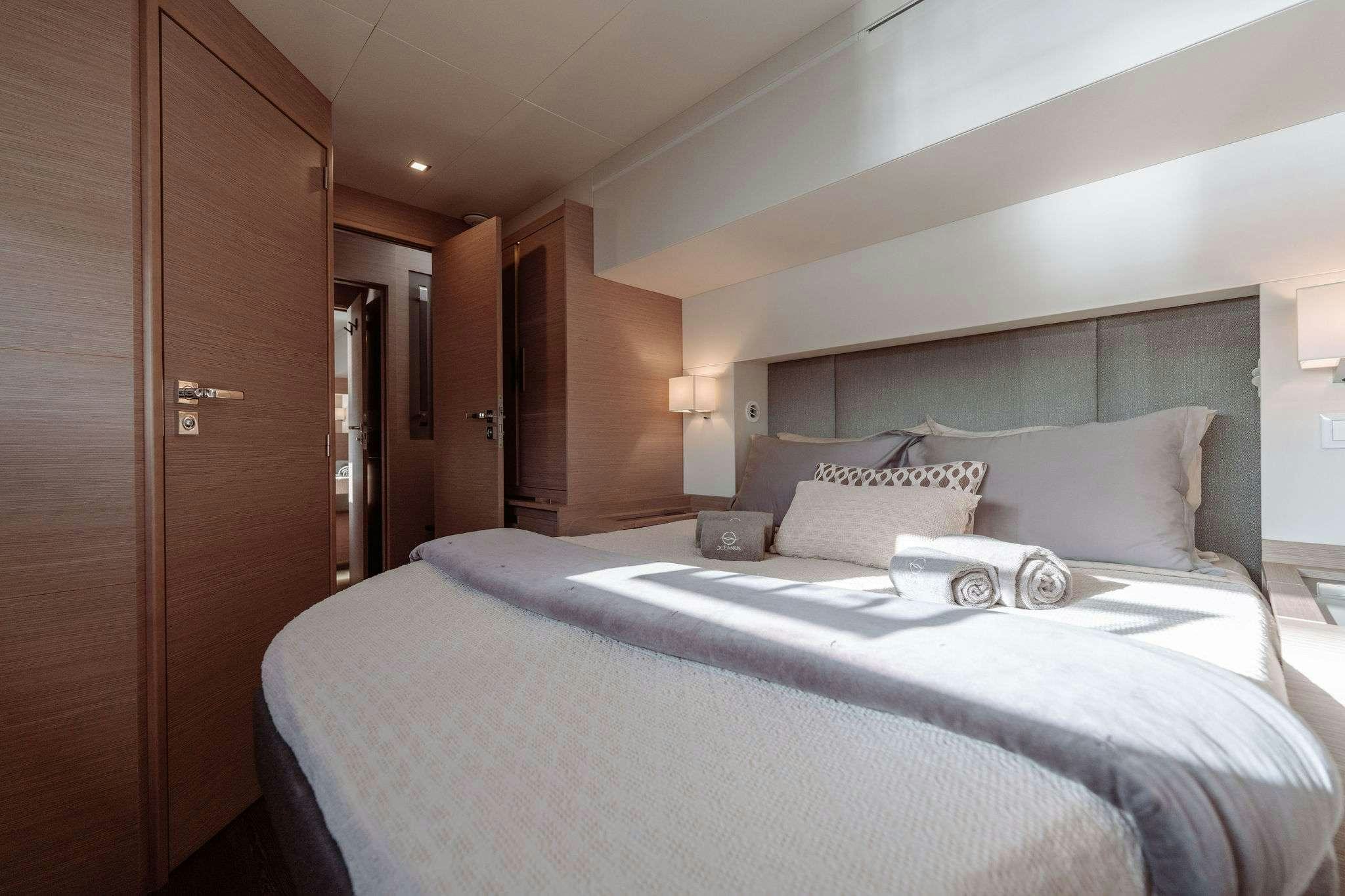 a bed in a hotel room aboard LIQUID SKY Yacht for Charter