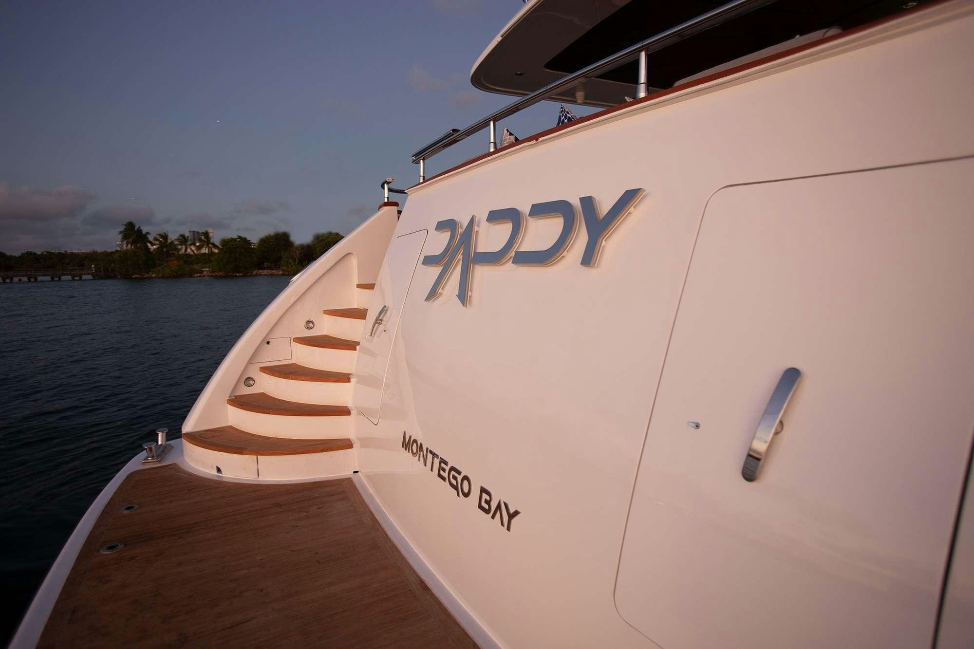 a white boat on a dock aboard DADDY Yacht for Charter