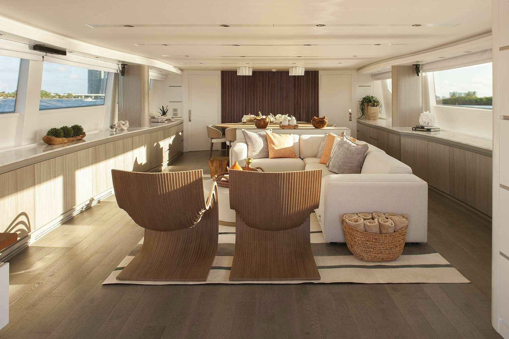 a living room with a couch and a table aboard DADDY Yacht for Charter