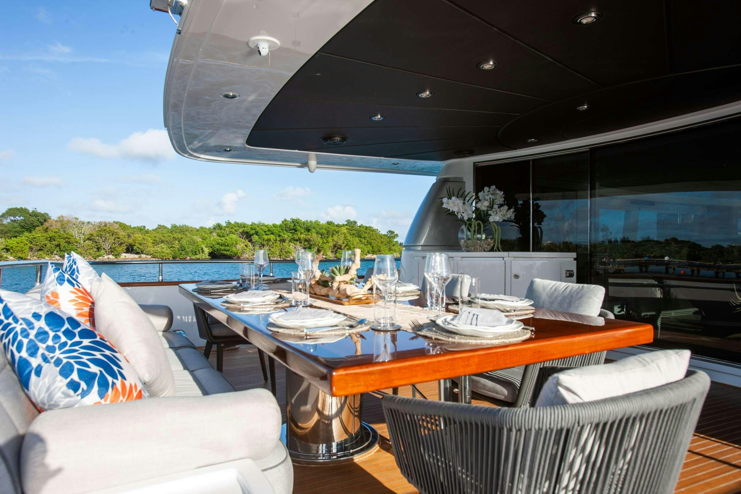 a table set for a meal aboard DADDY Yacht for Charter
