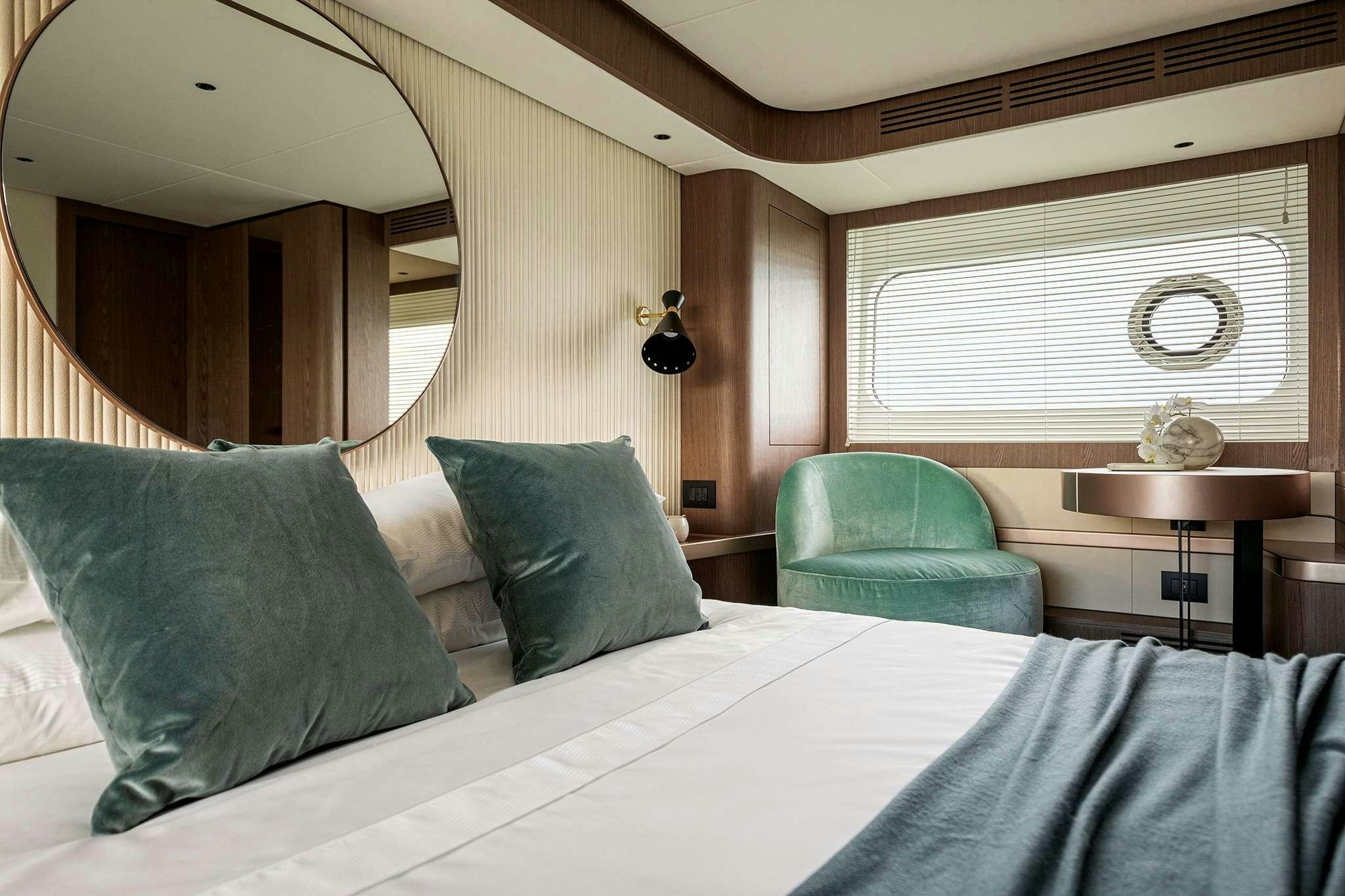 a bed with a white sheet and pillows aboard AZIMUT MAGHELLANO 66 Yacht for Charter
