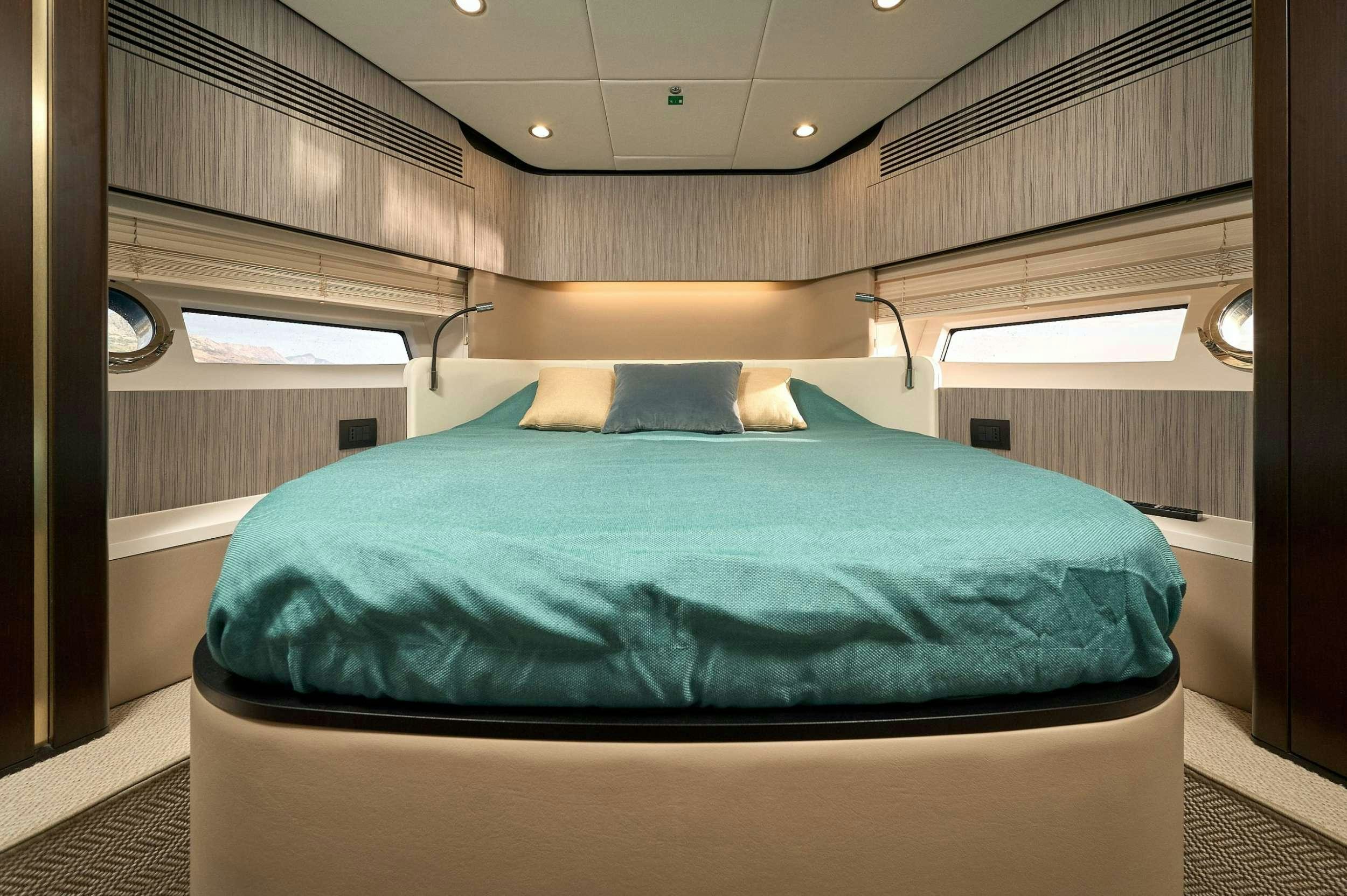 a bed in a room aboard AZIMUT 55 FLY - AMPARITO IV Yacht for Charter
