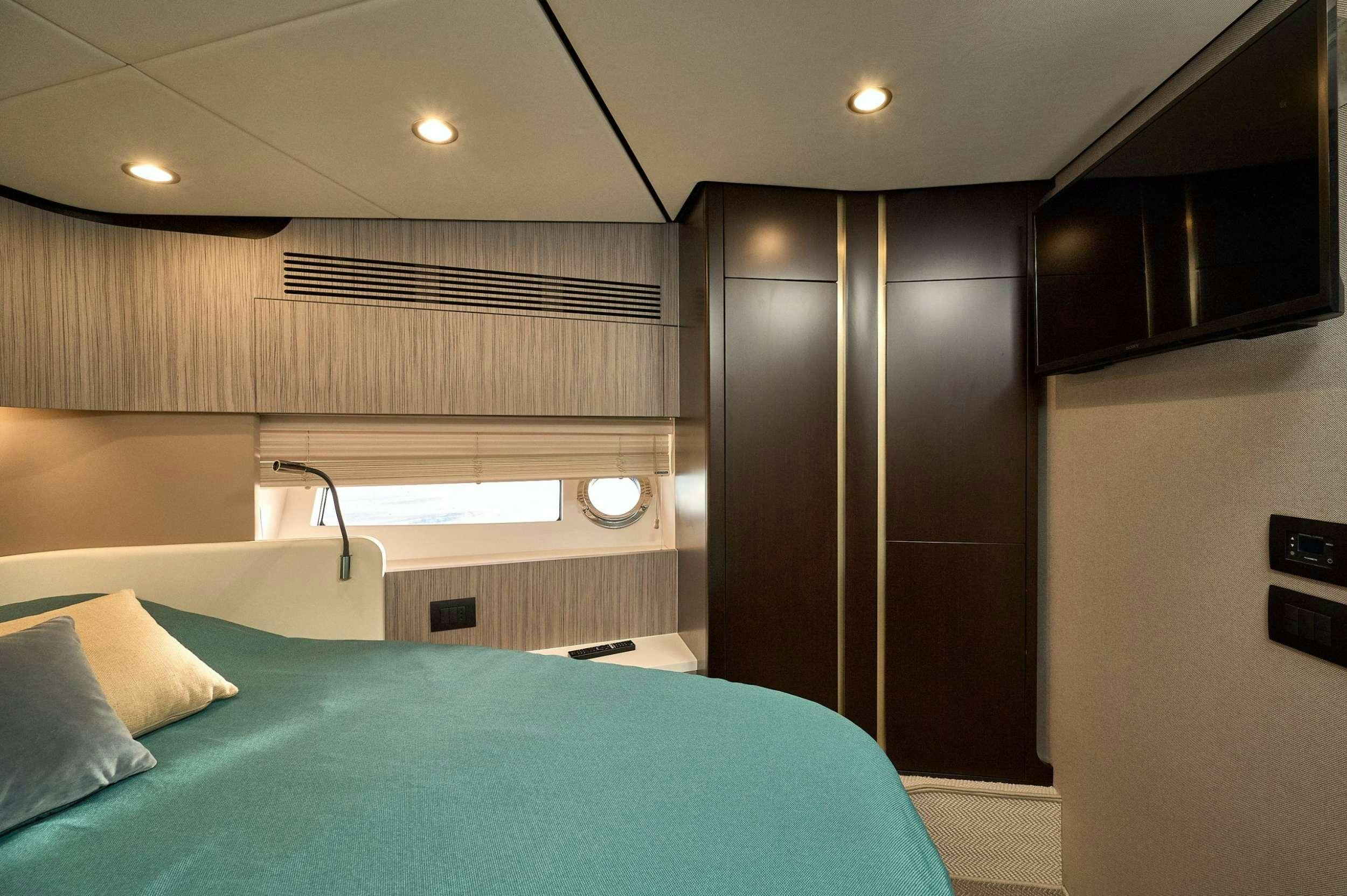 a bed in a room aboard AZIMUT 55 FLY - AMPARITO IV Yacht for Charter