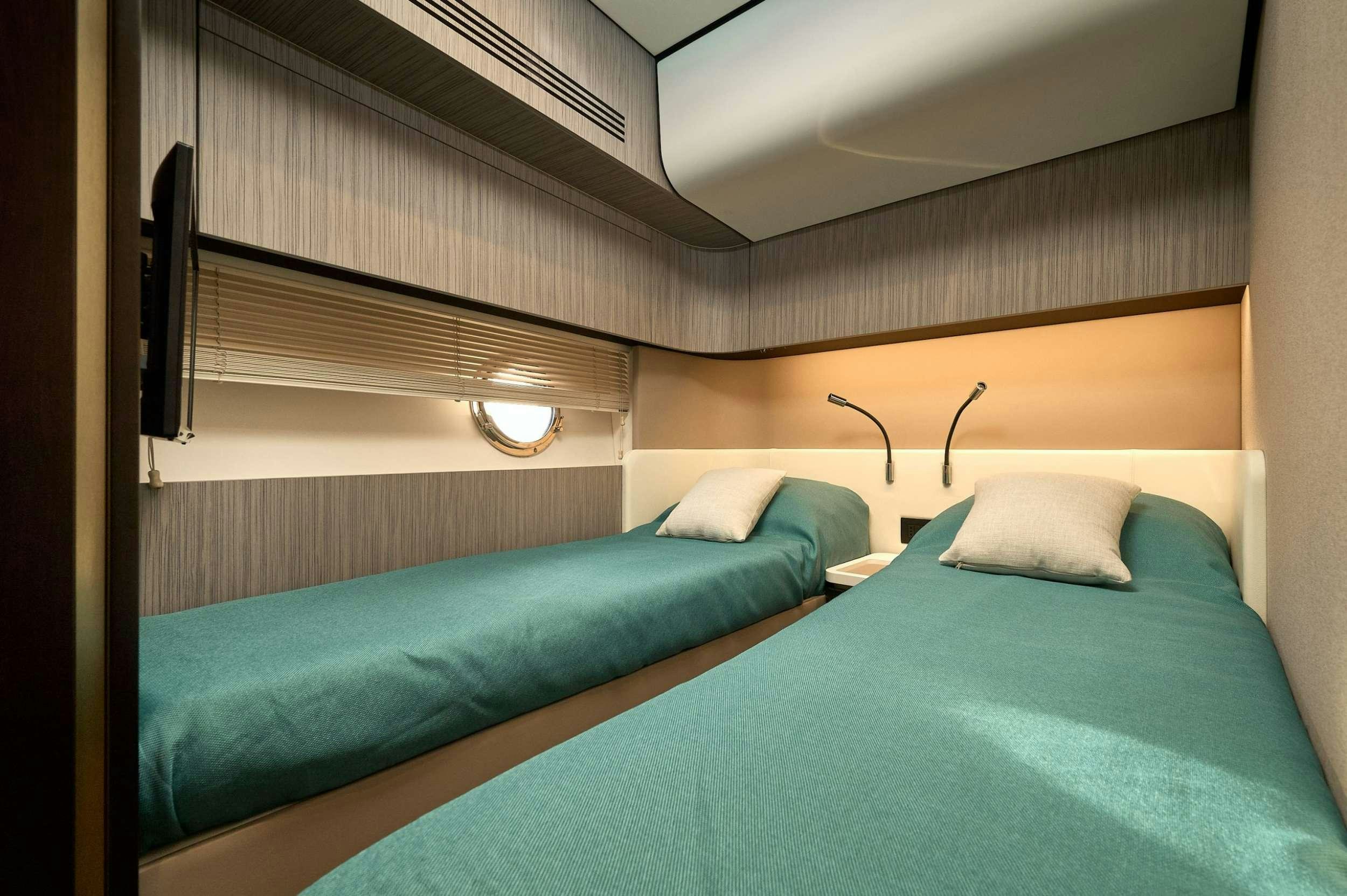 a room with two beds aboard AZIMUT 55 FLY - AMPARITO IV Yacht for Charter