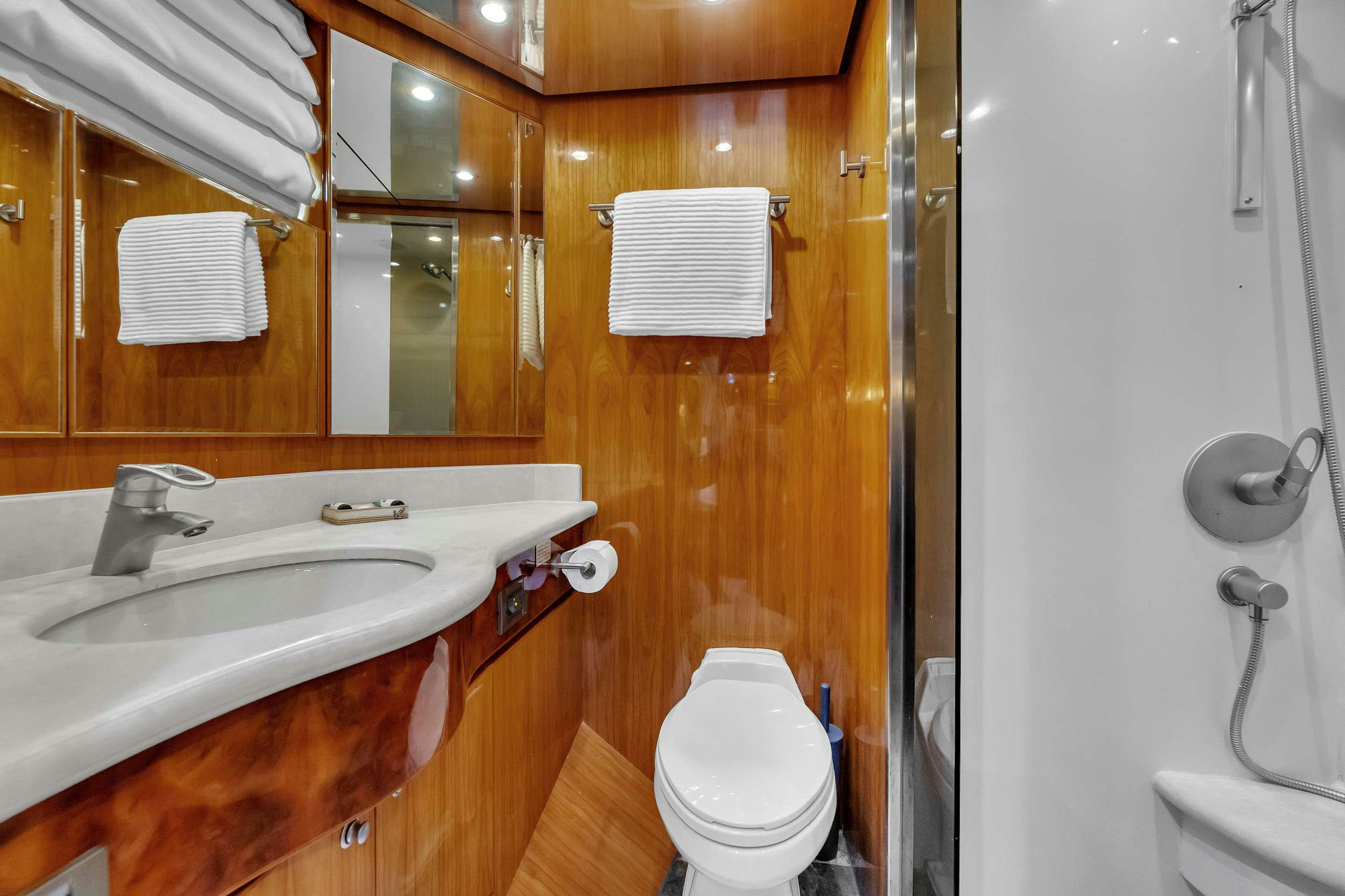 a bathroom with a sink and toilet aboard DREAM ON Yacht for Charter