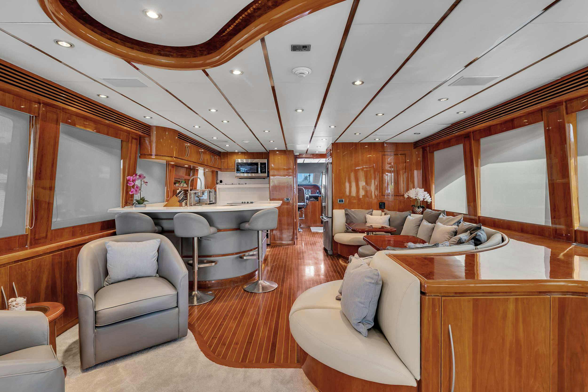 a living room with a large wood paneled ceiling aboard DREAM ON Yacht for Charter