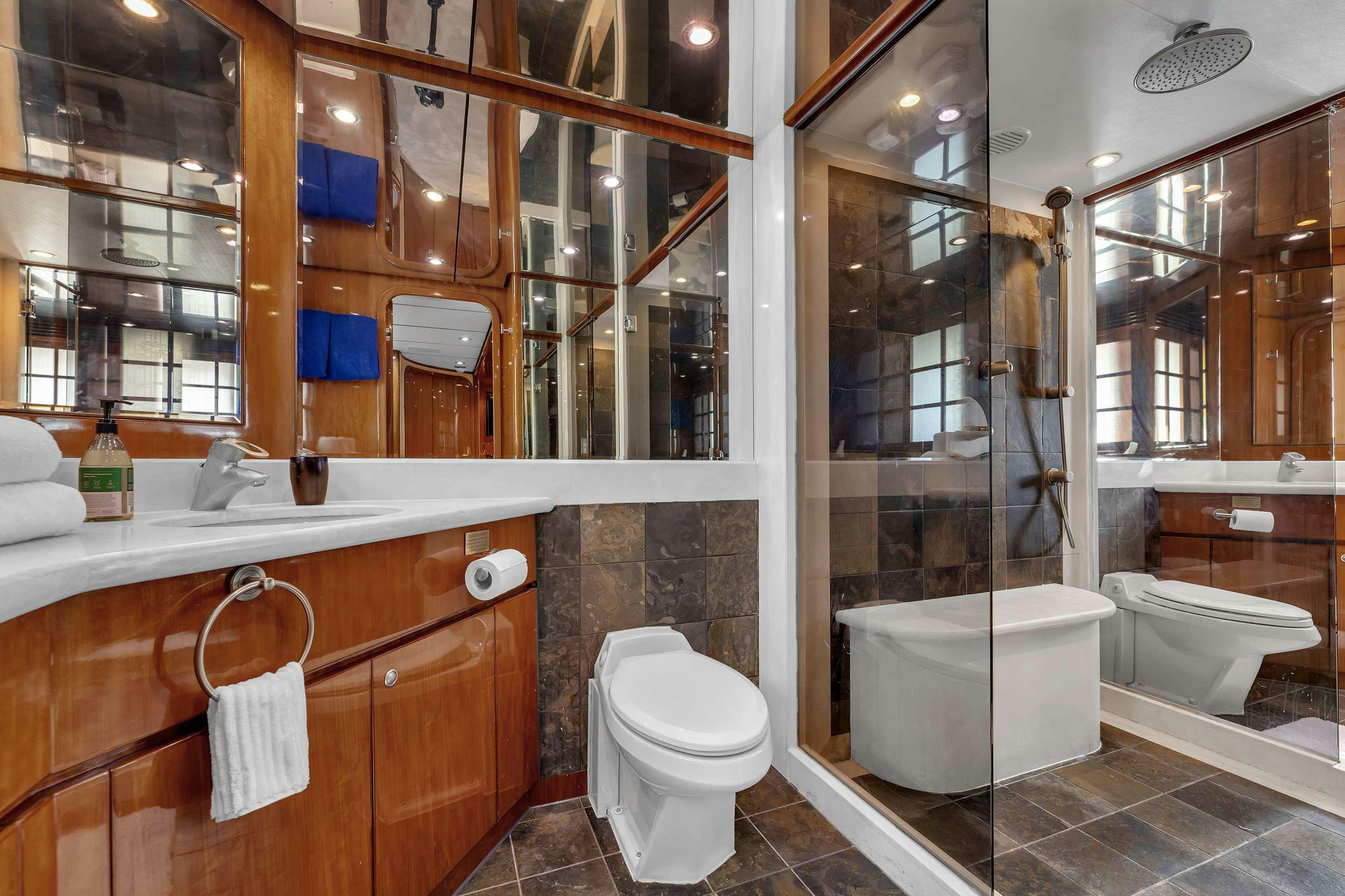 a bathroom with a glass shower aboard DREAM ON Yacht for Charter